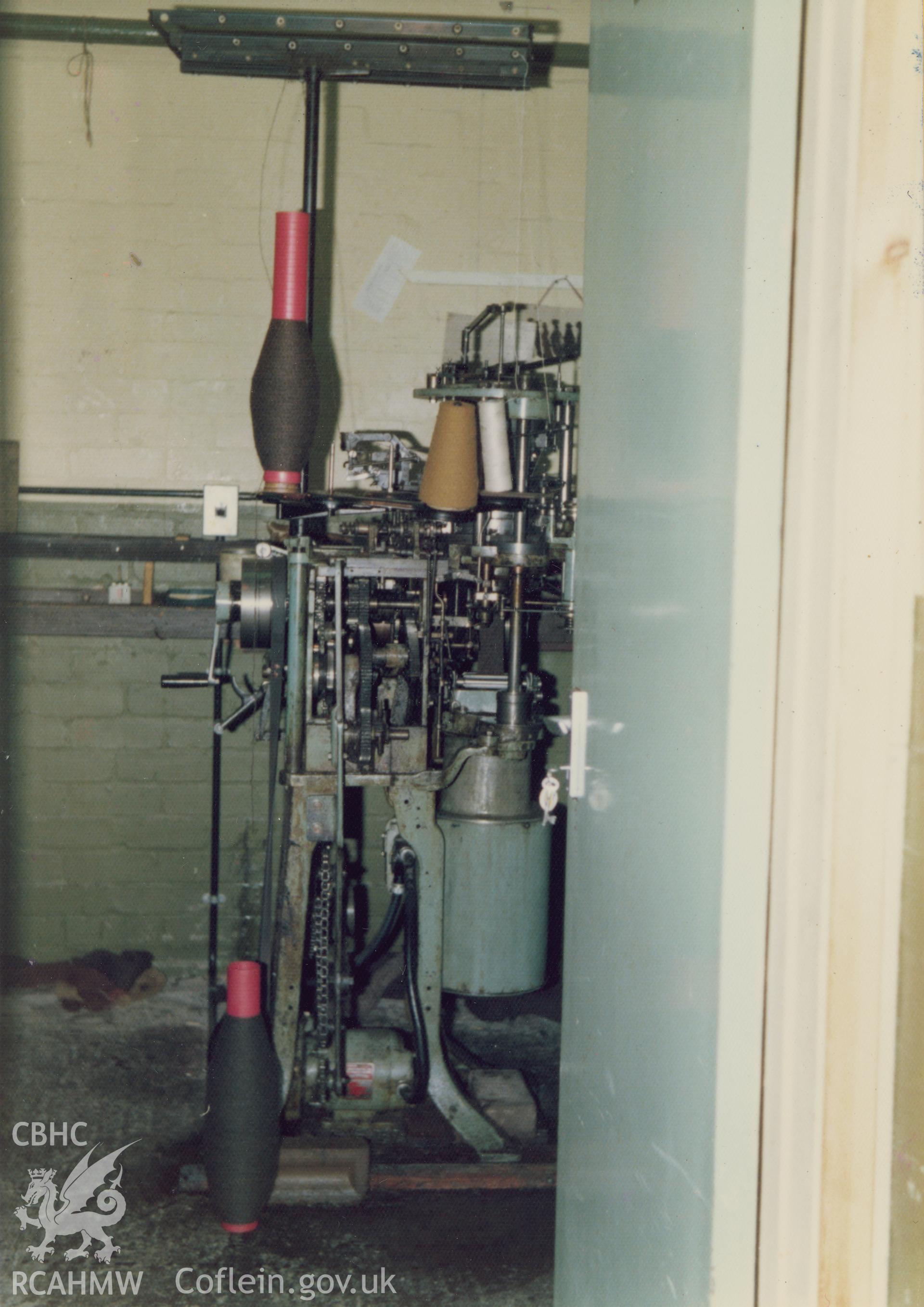 Interior view showing the golf sock knitting machine at Cambrian Wool Factory.