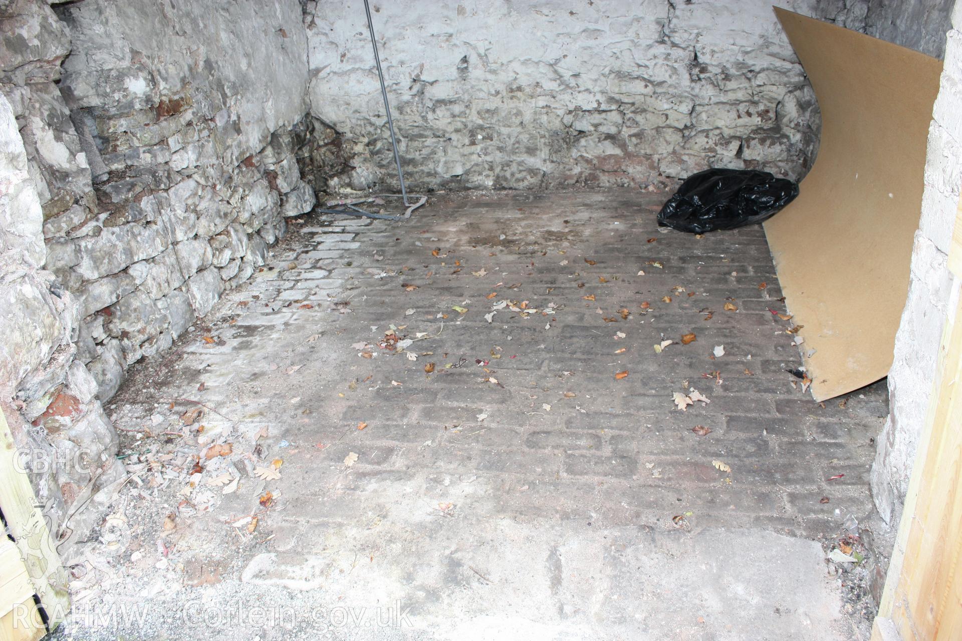 View of old wall in modernised house's east gable-end, to west of cart-house.