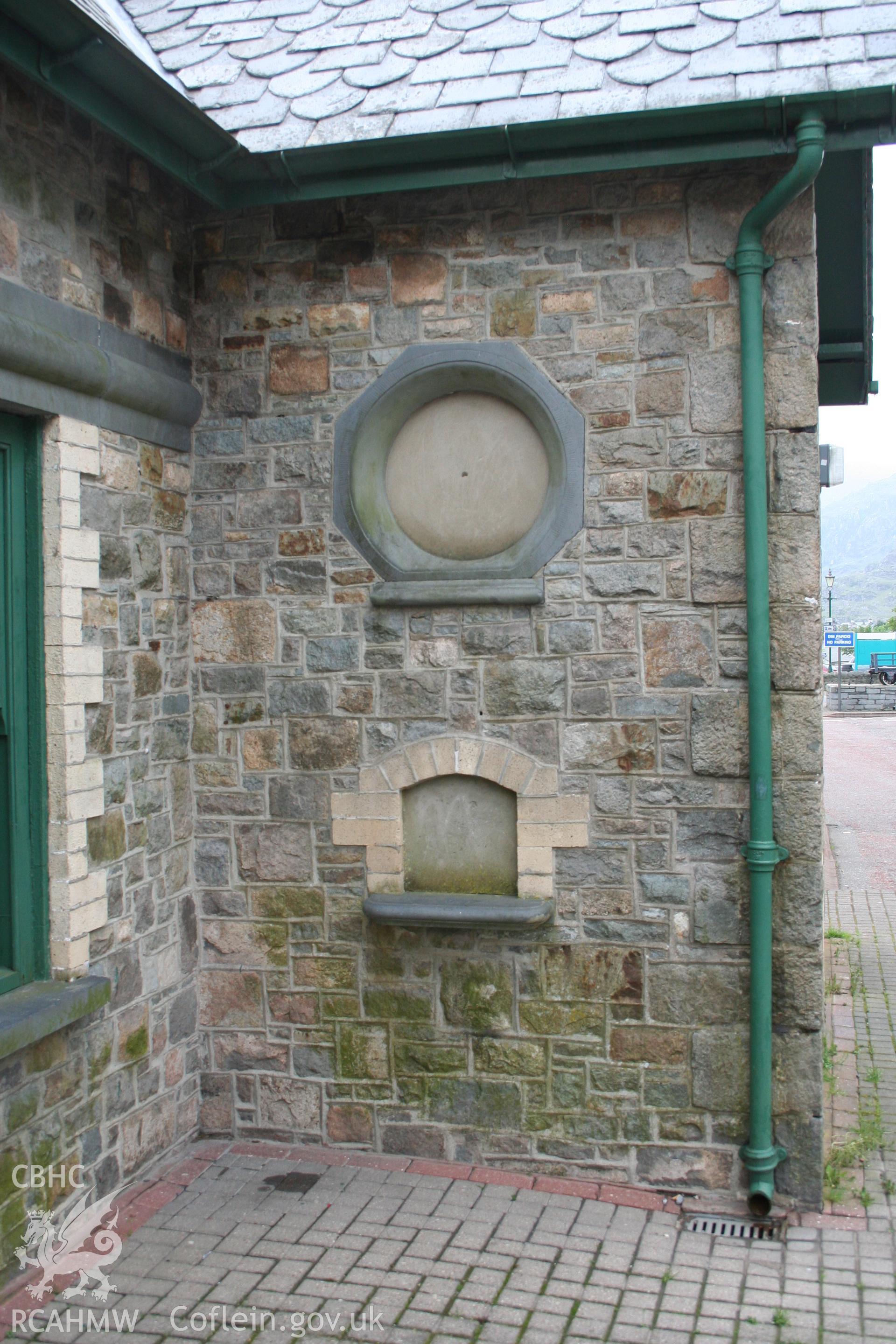 Detail of ticket window and clock housing.