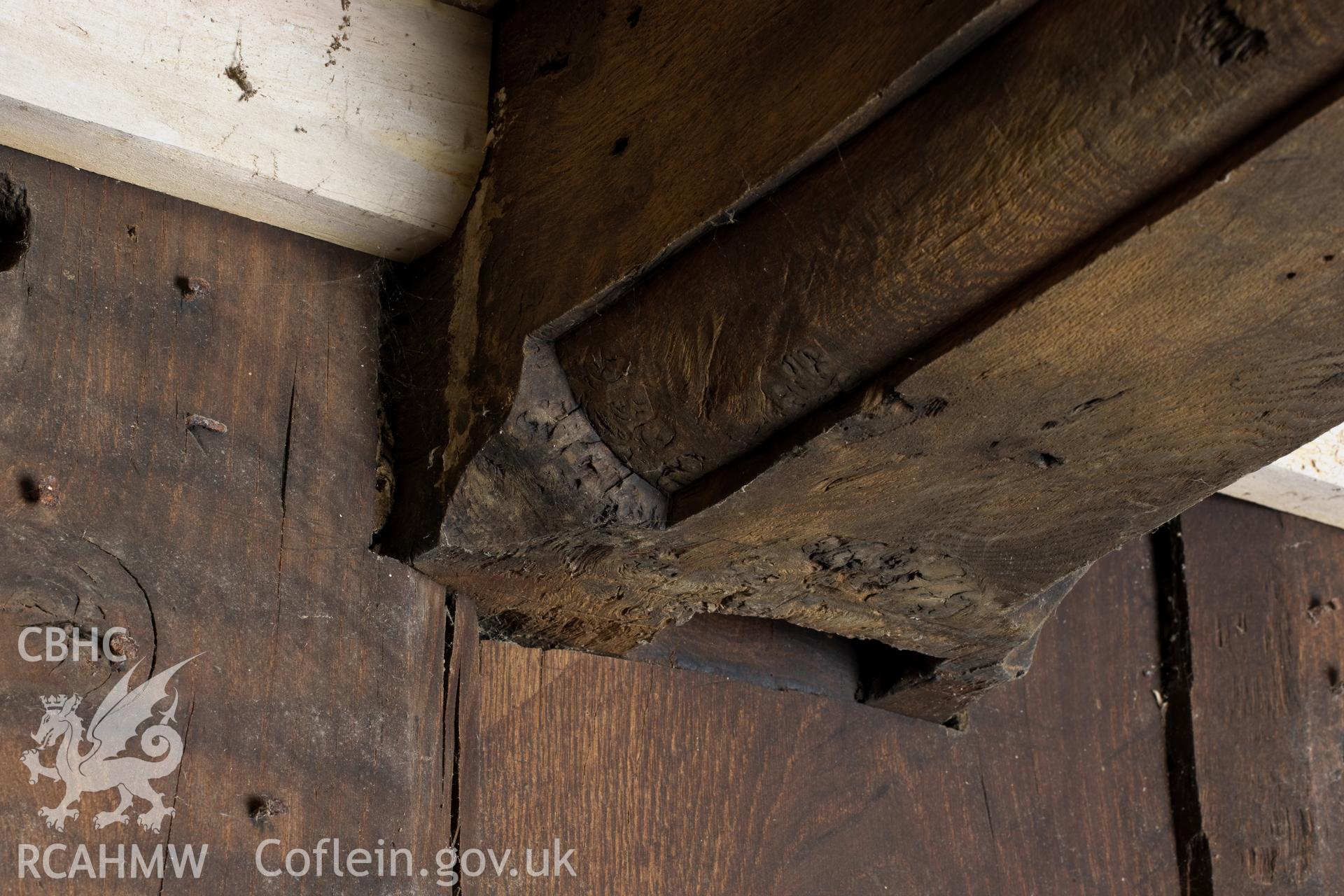 Richly moulded beam over partition.