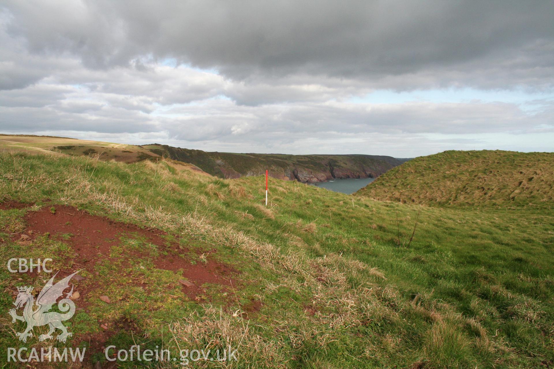 Looking north-east along the inside face of the inner rampart of the annexe defences, towards the main fort entrance.