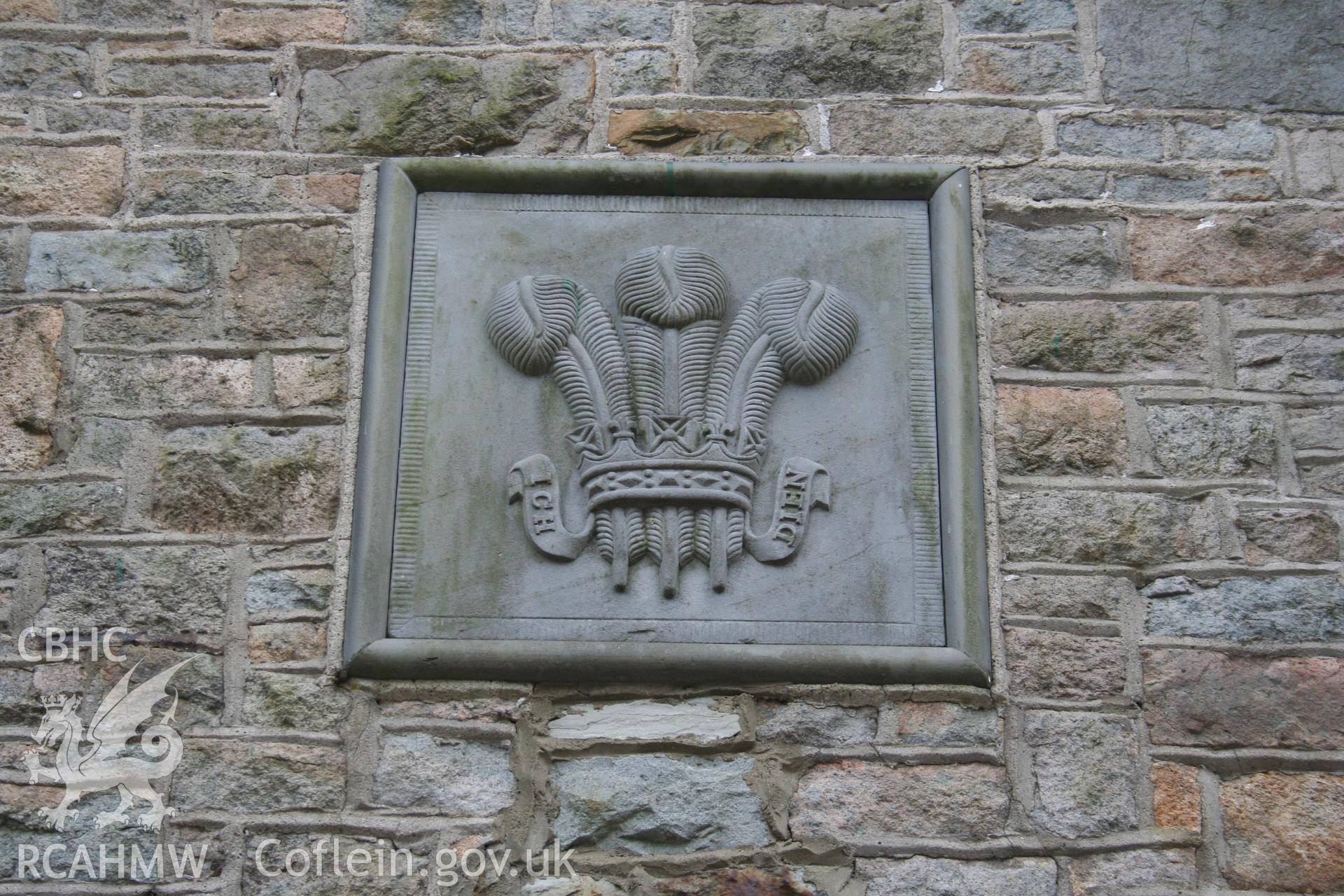 Slate plaque set in gable of west wing.