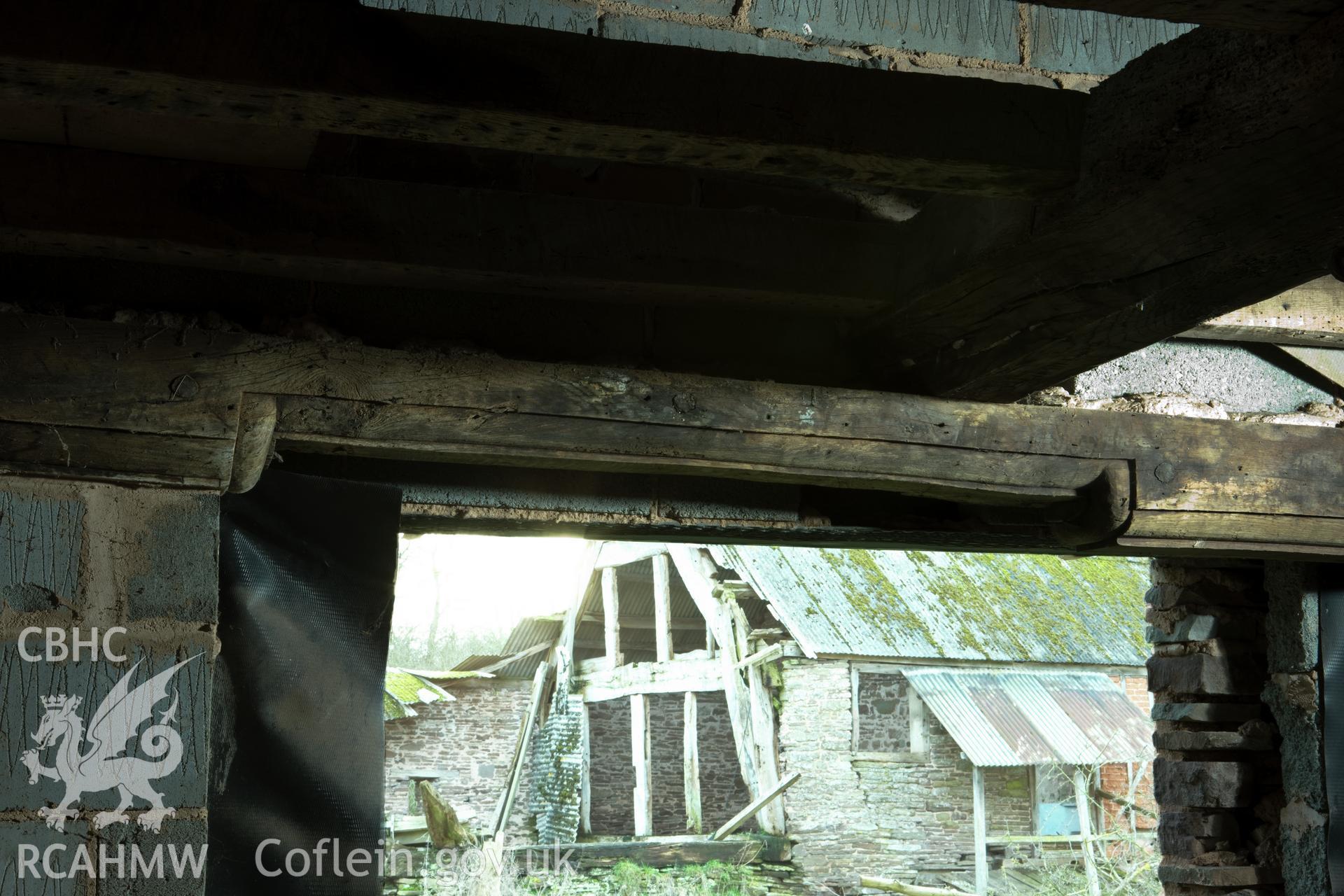 Moulded beam/ window frame in inner room. Originally in principal room. With view to outbuilding.