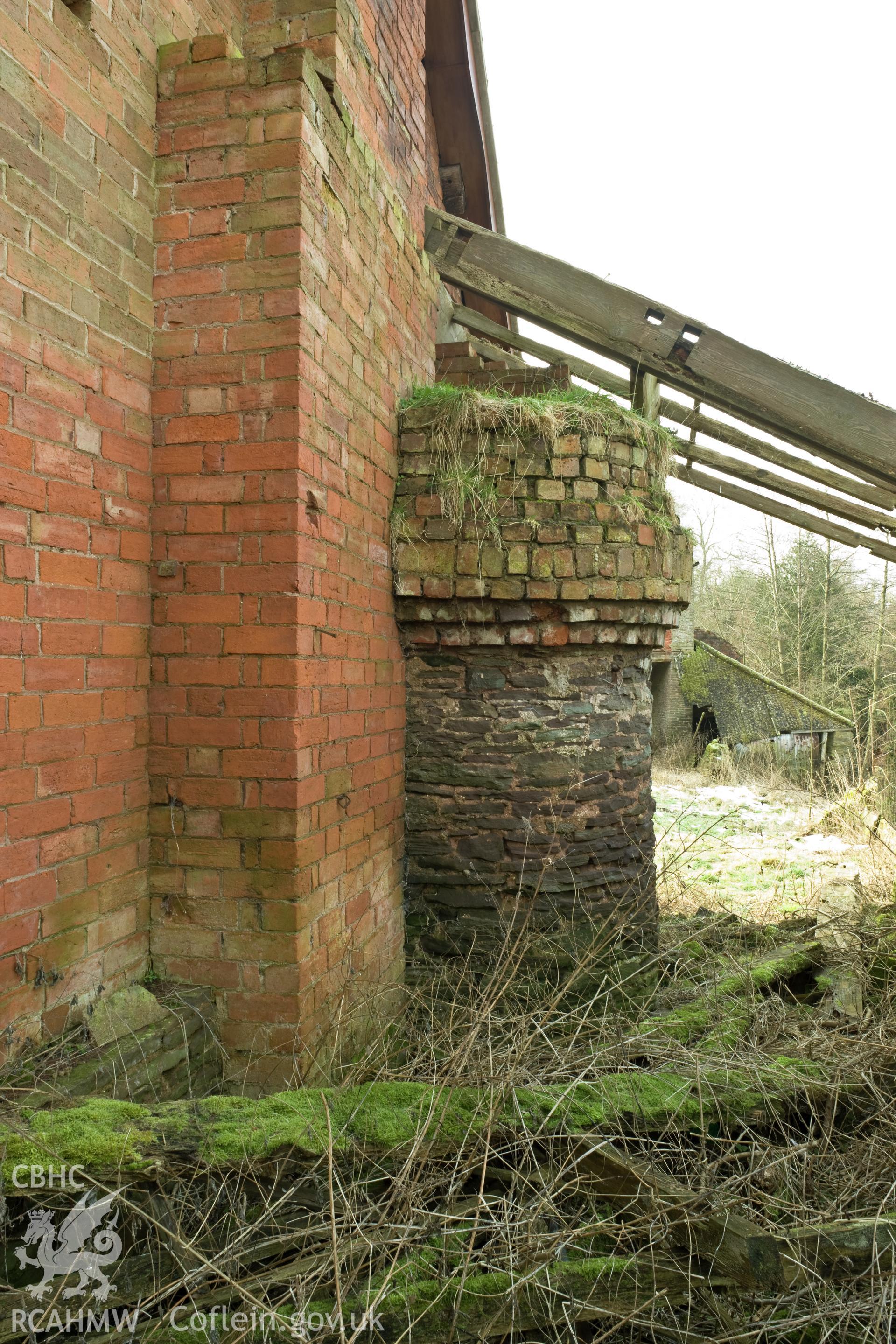 Chimney base on northwest facade.