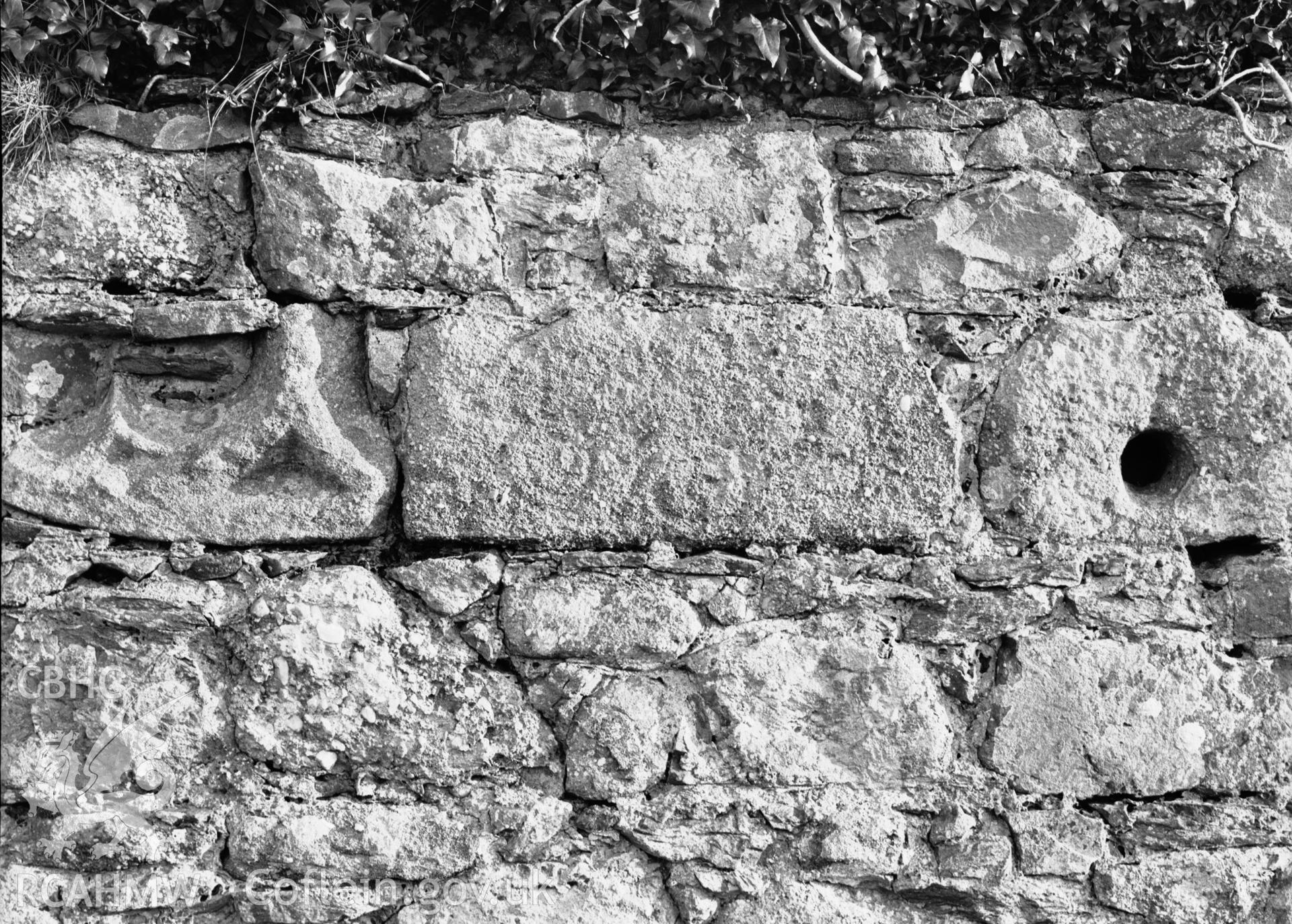 Stones in churchyard wall