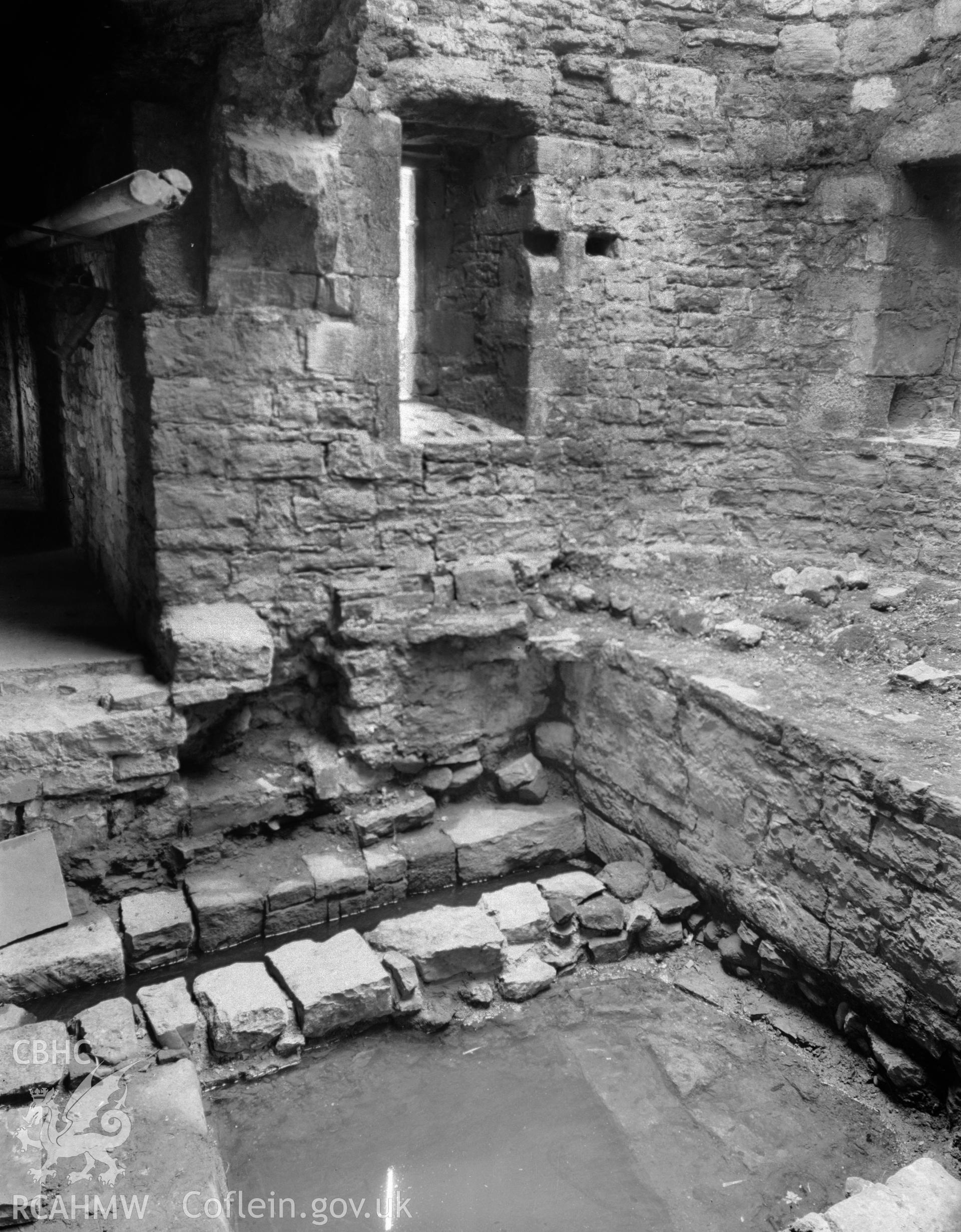 Investigator's notes made during resurvey of Gunners Walk, Beaumaris Castle, regarding the 'tide mill'. Includes one black and white photograph.