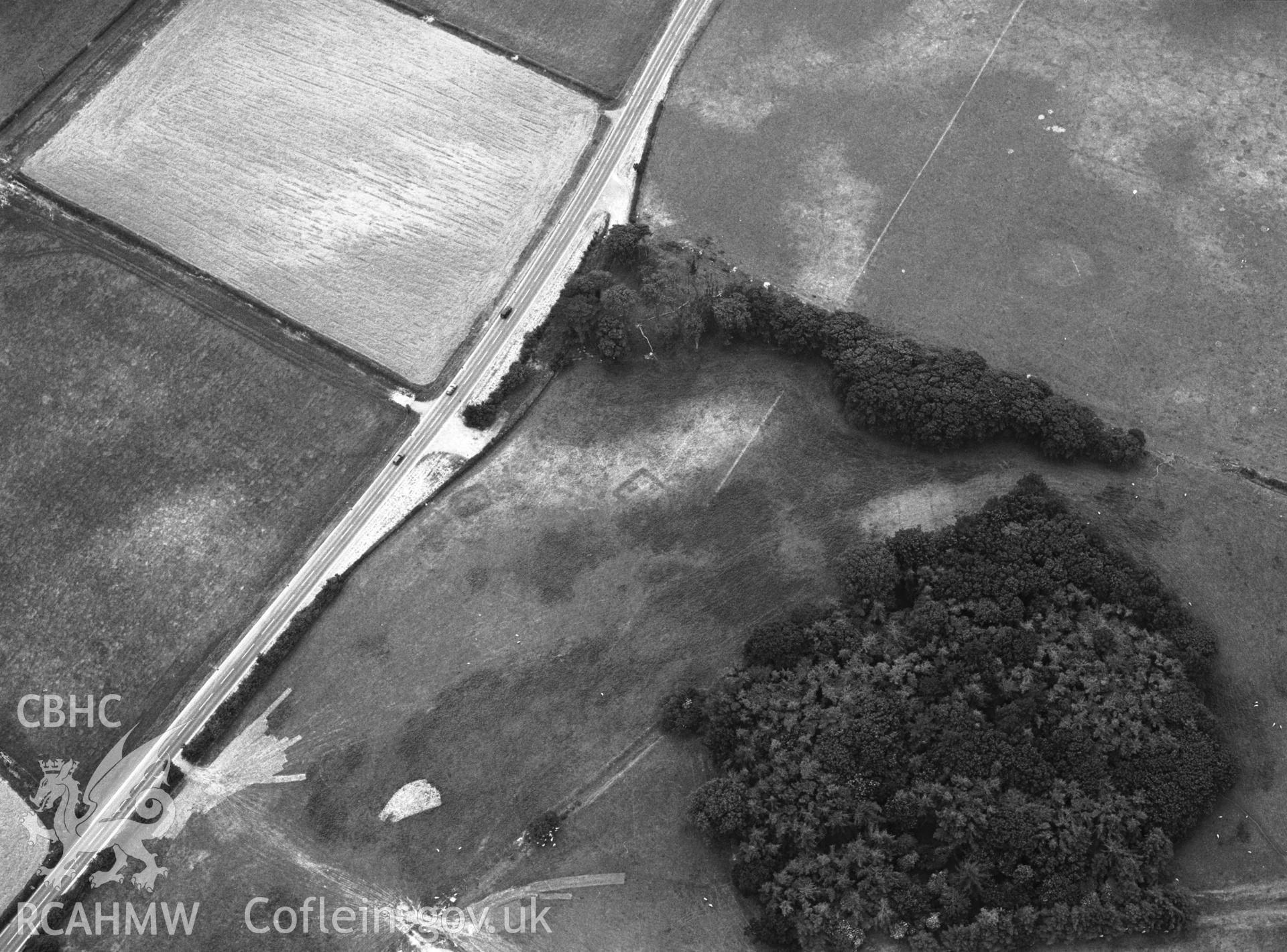 RCAHMW black and white oblique aerial photograph of cropmarks north of Croes Faen.