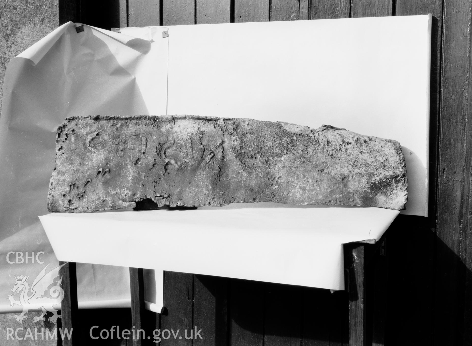 Digitised copy of a black and white negative showing part of lead coffin found at Rhuddgaer, produced by RCAHMW before 1960