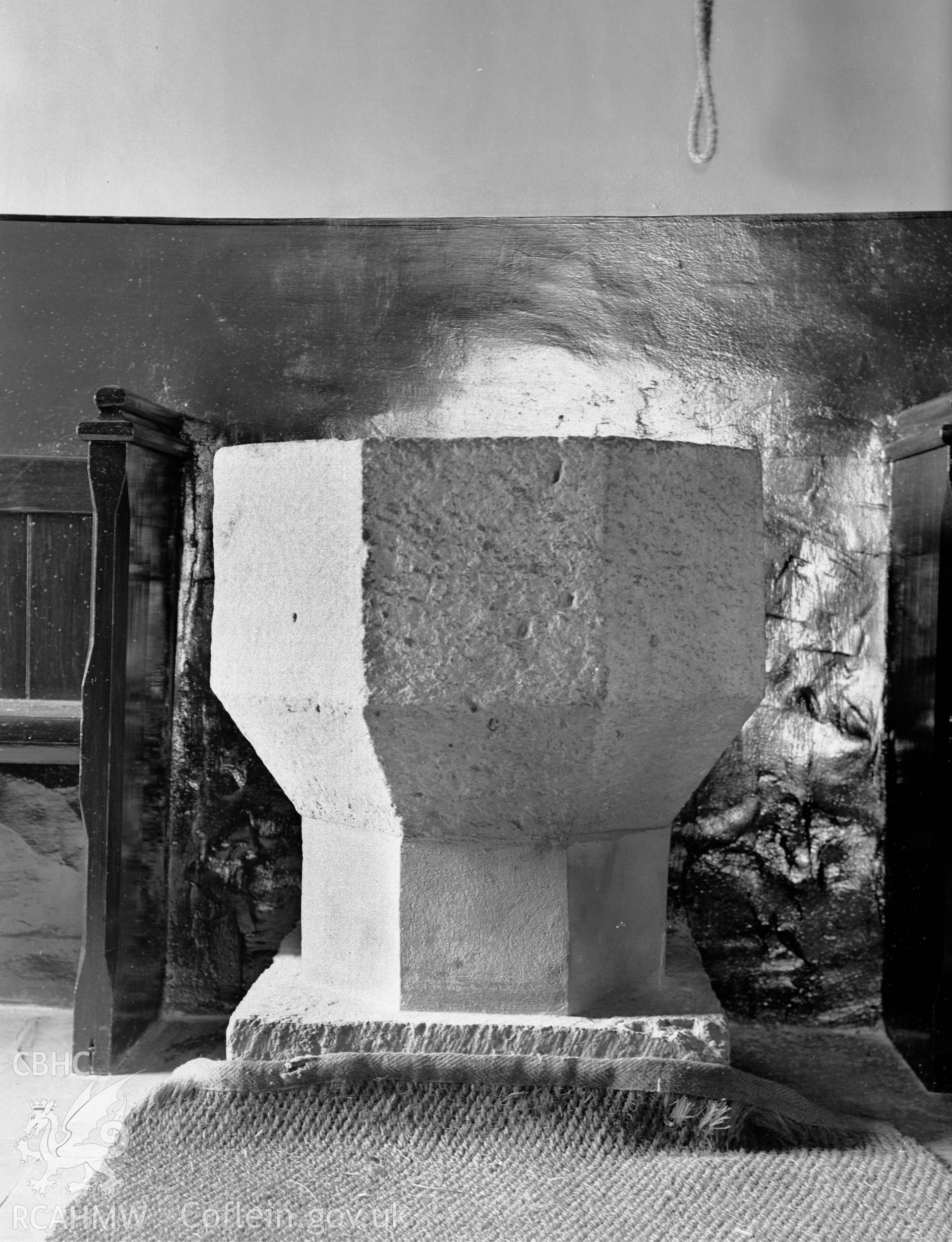 Digitised copy of a black and white negative showing the font at St Michael's Church, produced by RCAHMW, June 1929.