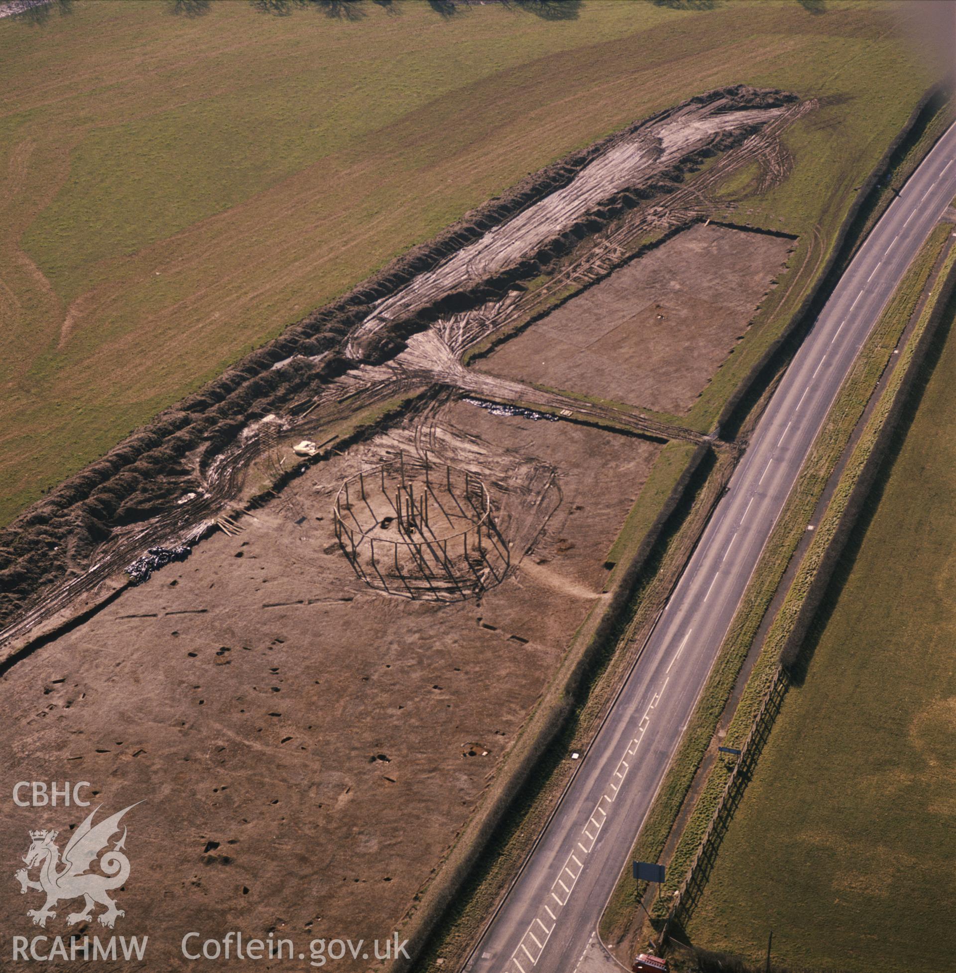 RCAHMW colour oblique aerial photograph of Sarn y Bryn Caled pit circle, taken by C R Musson, 1991.