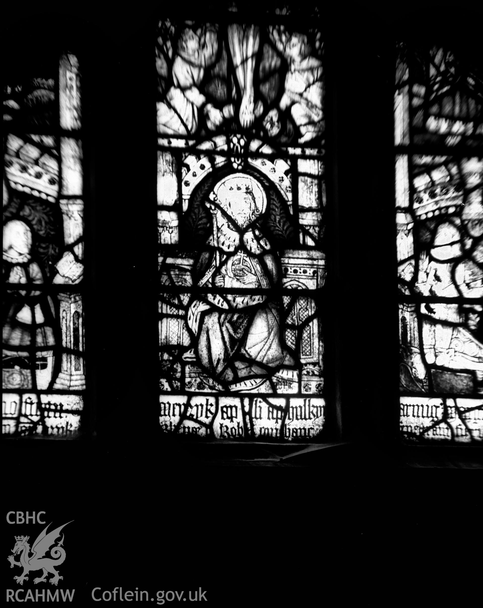 Digitised copy of a black and white negative showing stained glass window at St Cadwaladr's church, produced by RCAHMW, July 1931.