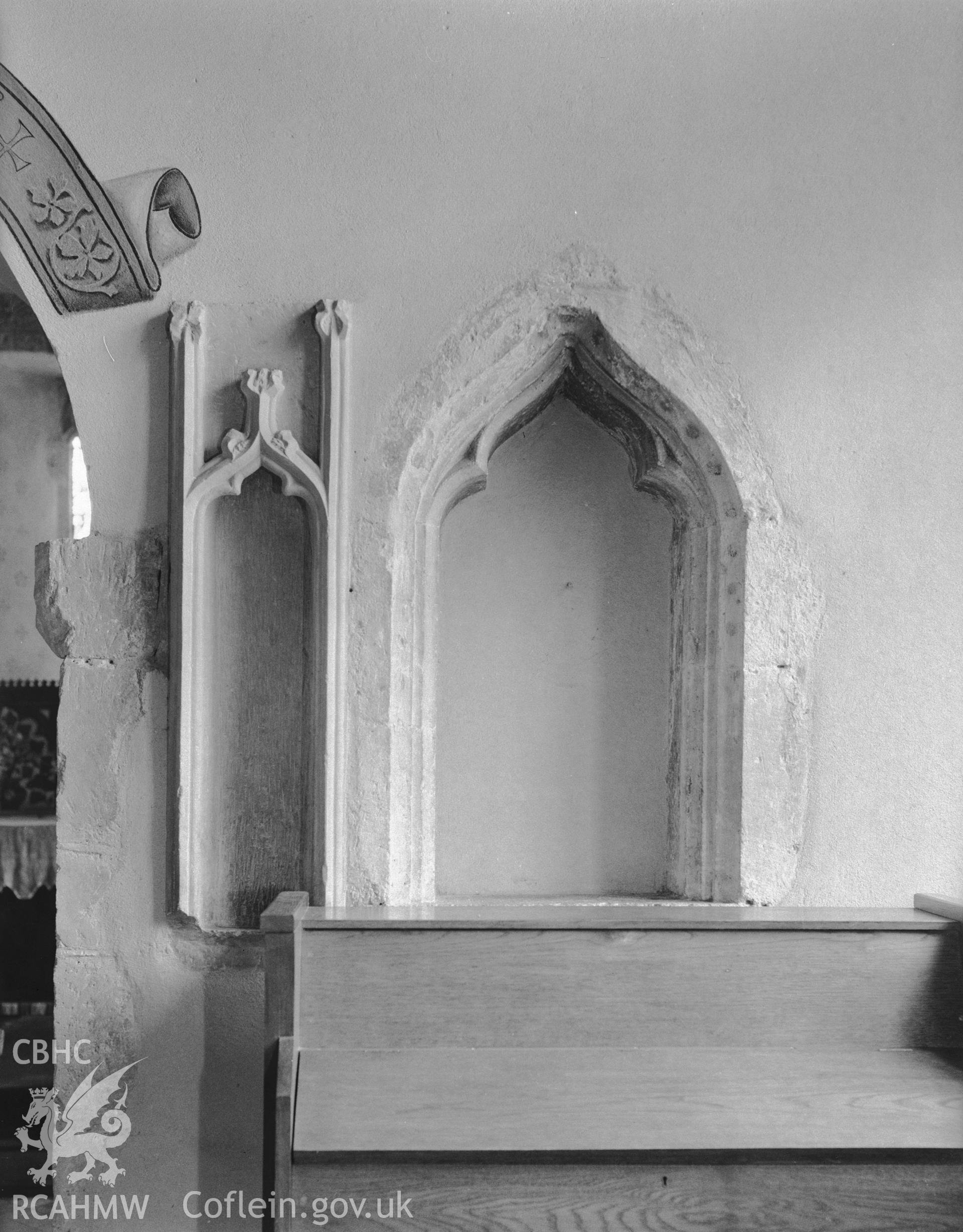 Interior view showing the south side of the chancel arch.