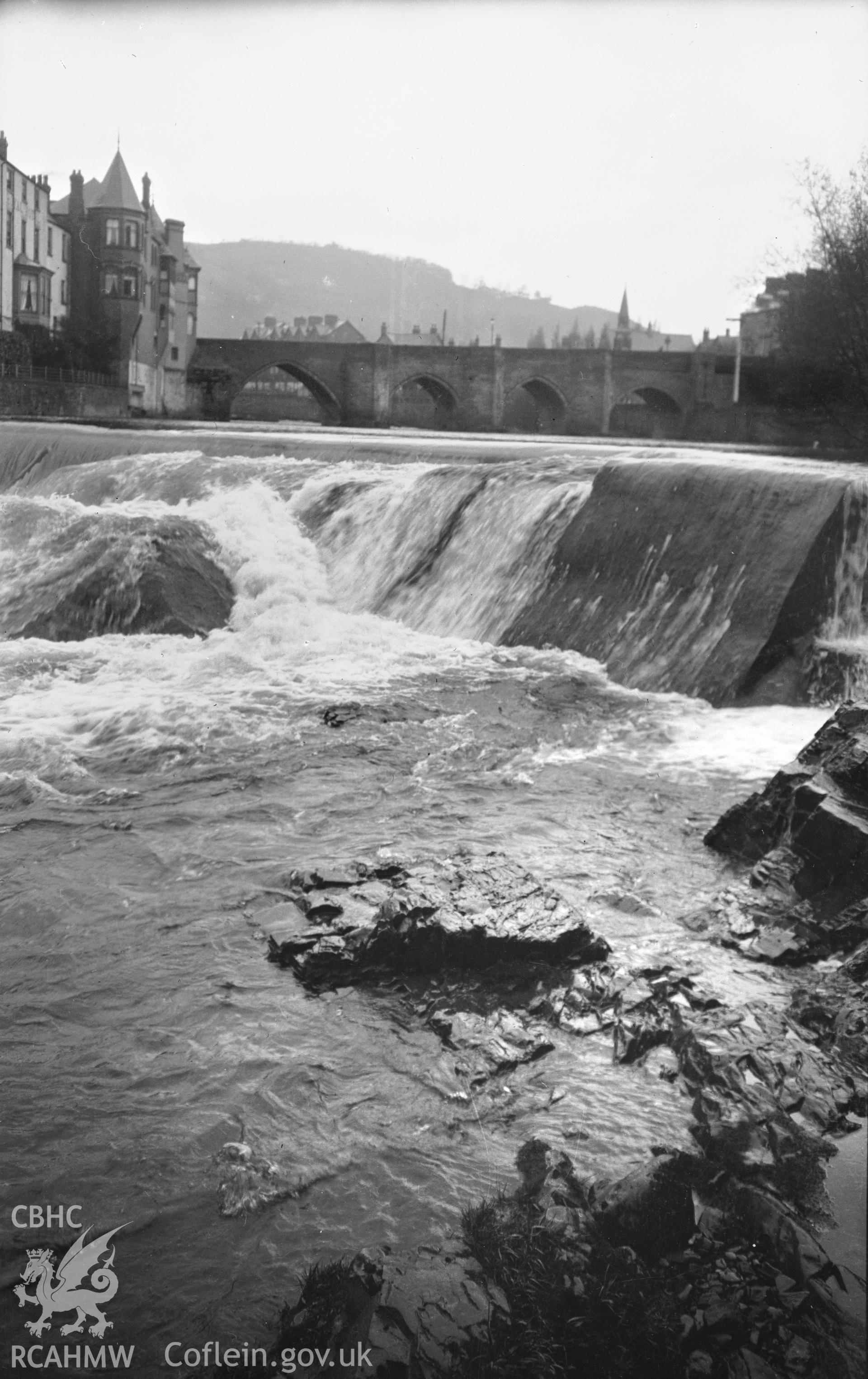 A single black and white photograph from an unknown source showing Llangollen Bridge.  Negative held.