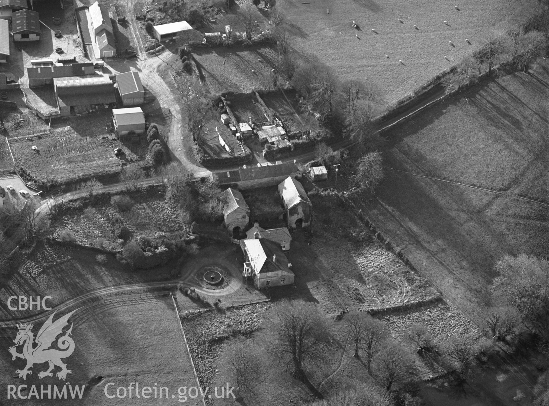 RCAHMW Black and white oblique aerial photograph of Temple Druid Cottages 1-3, Maenclochog, taken by C.R.Musson on the 07/02/1997