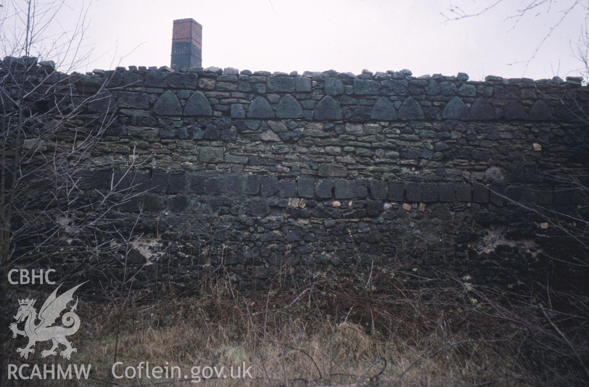 Colour slide of Hafod Copperworks, Swansea: showing works wall and moulded slag blocks.