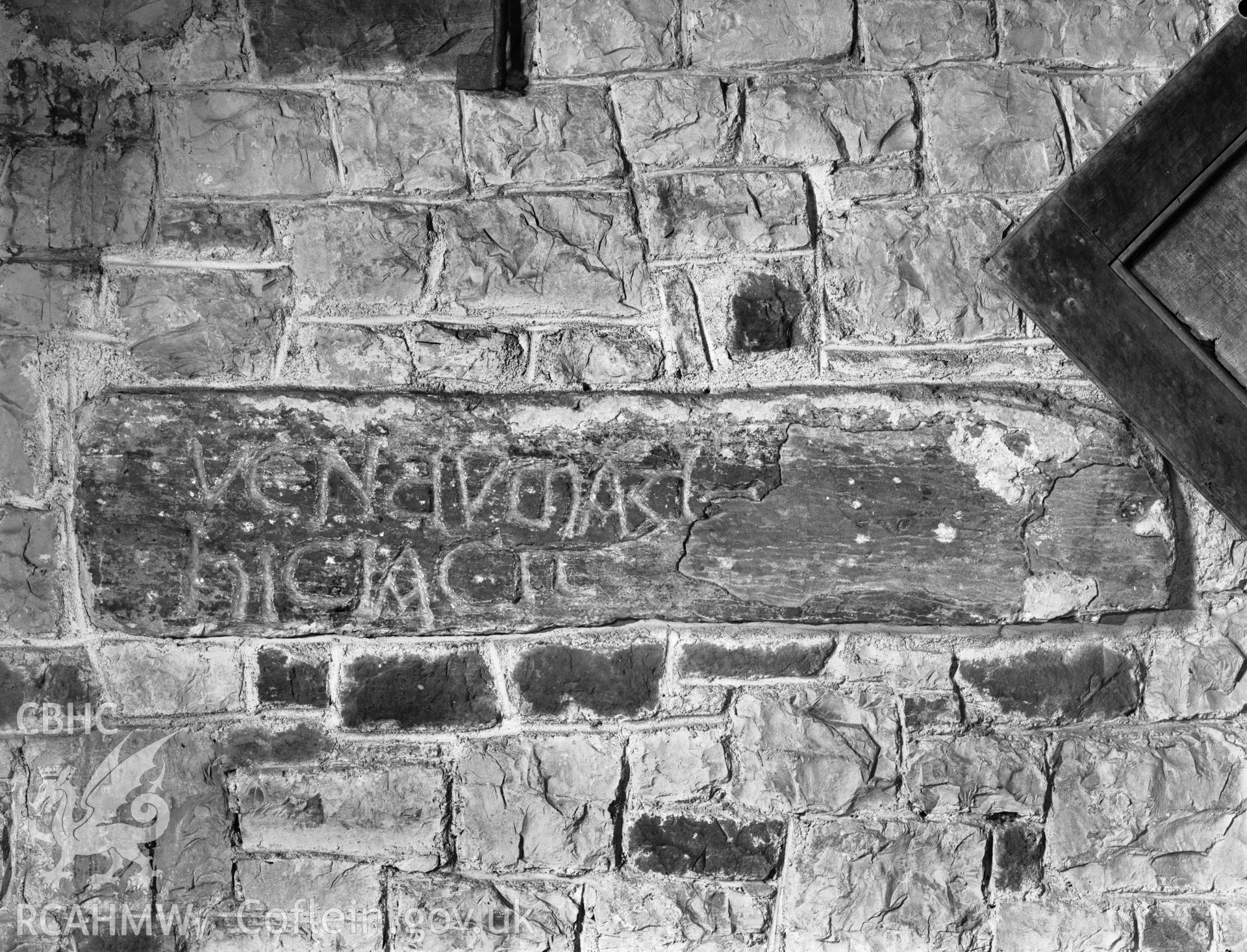 Inscribed stone in situ in the wall at Capel Llanilltern.