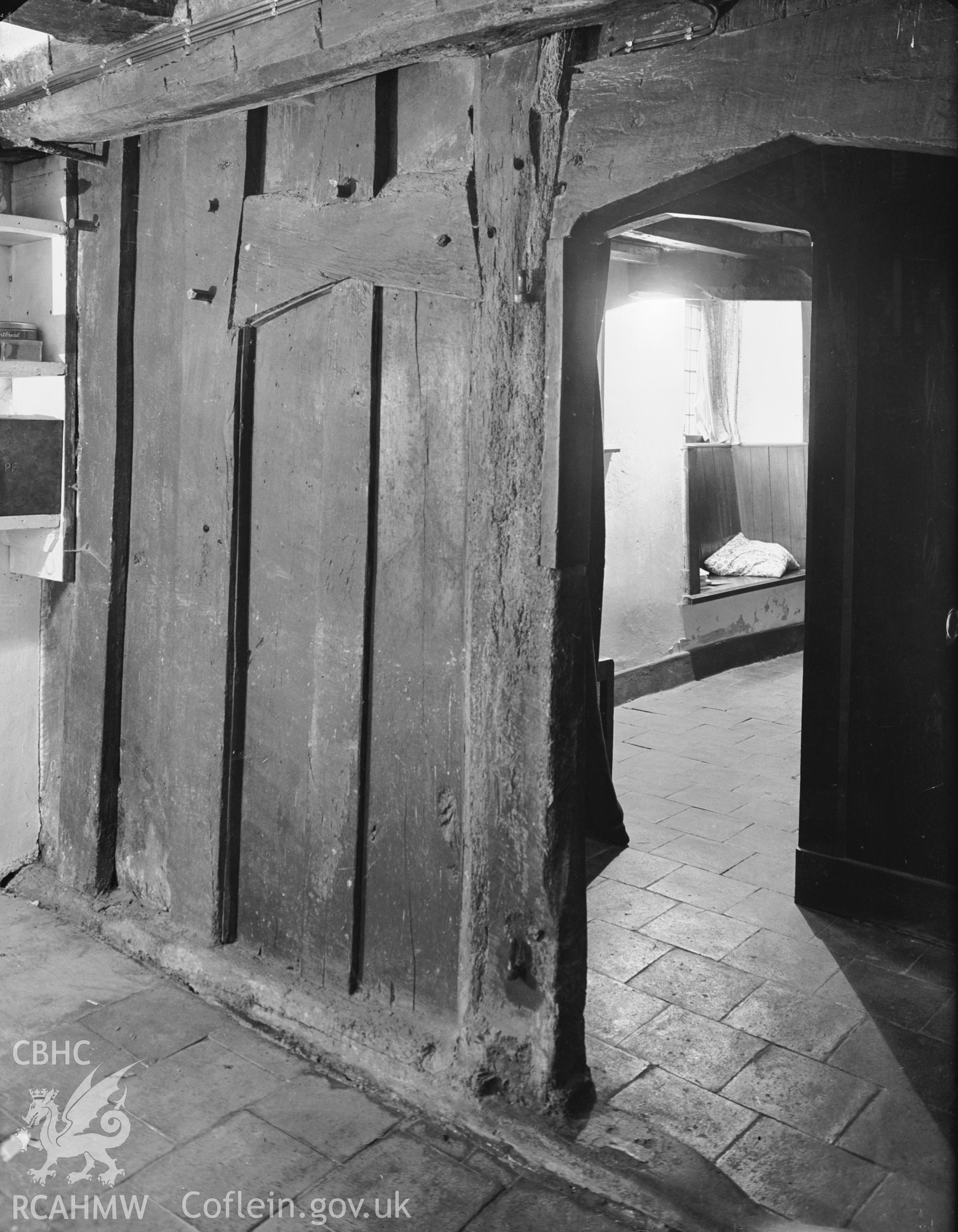 Interior view showing the original partition at the east end of the house.