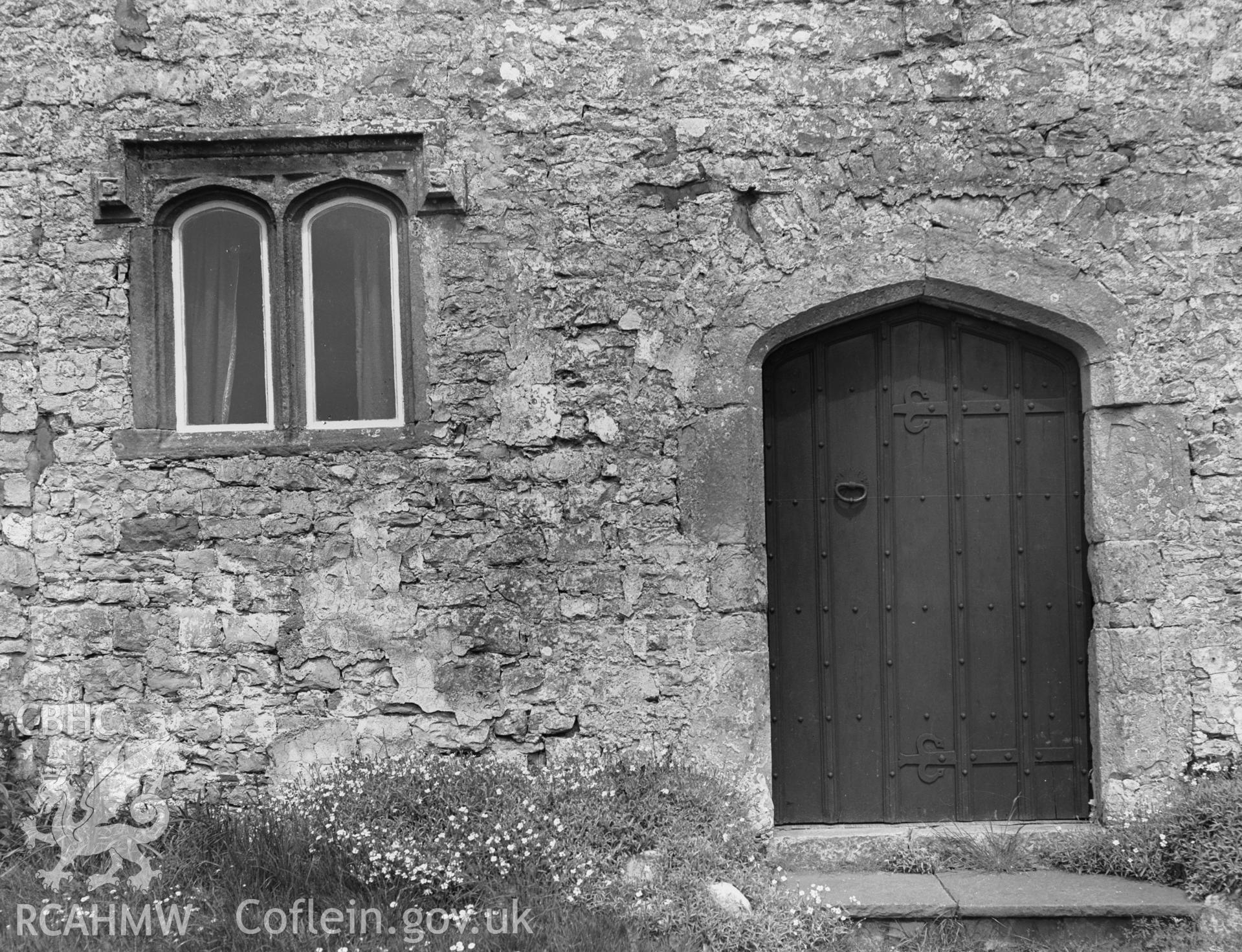 Exterior view showing doorway and window in the south elevation.