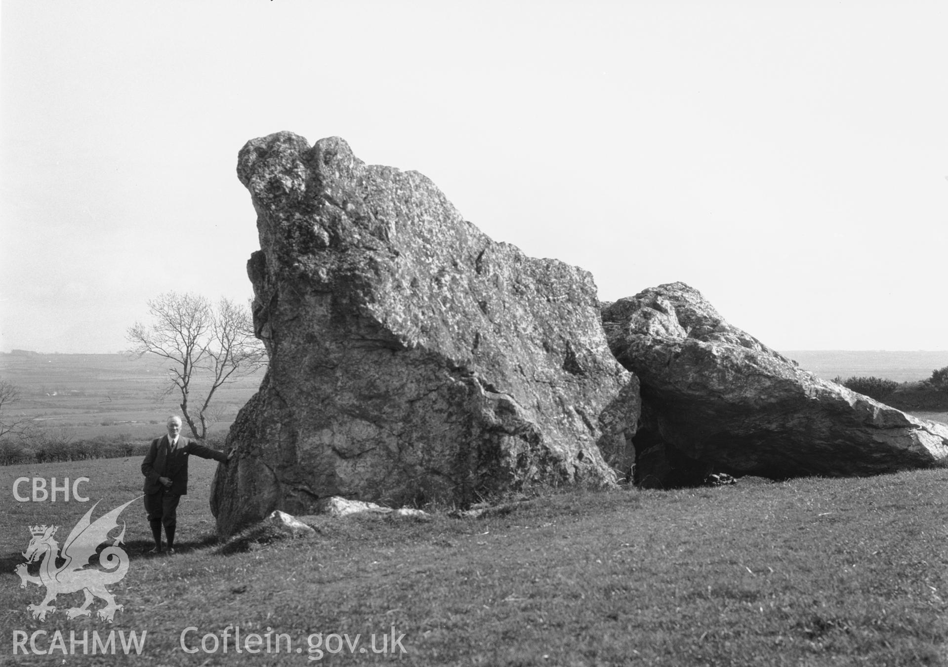 General view of cromlech with figure at the base.