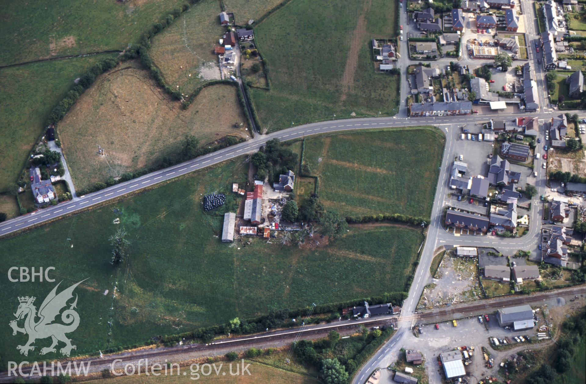 Slide of RCAHMW colour oblique aerial photograph of Caersws Roman Military Settlement, taken by C.R. Musson, 26/8/1995.