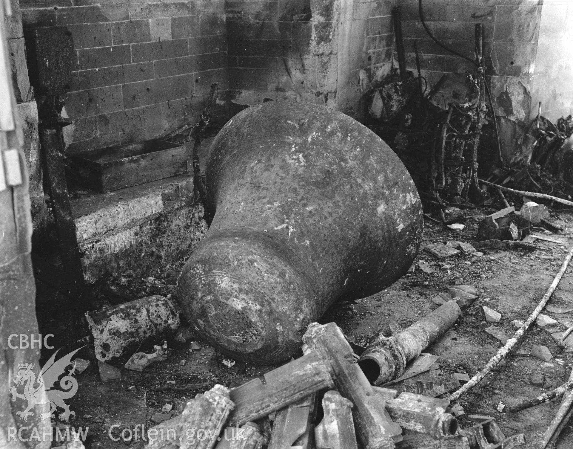 View of the bell showing damage to the church caused by enemy action