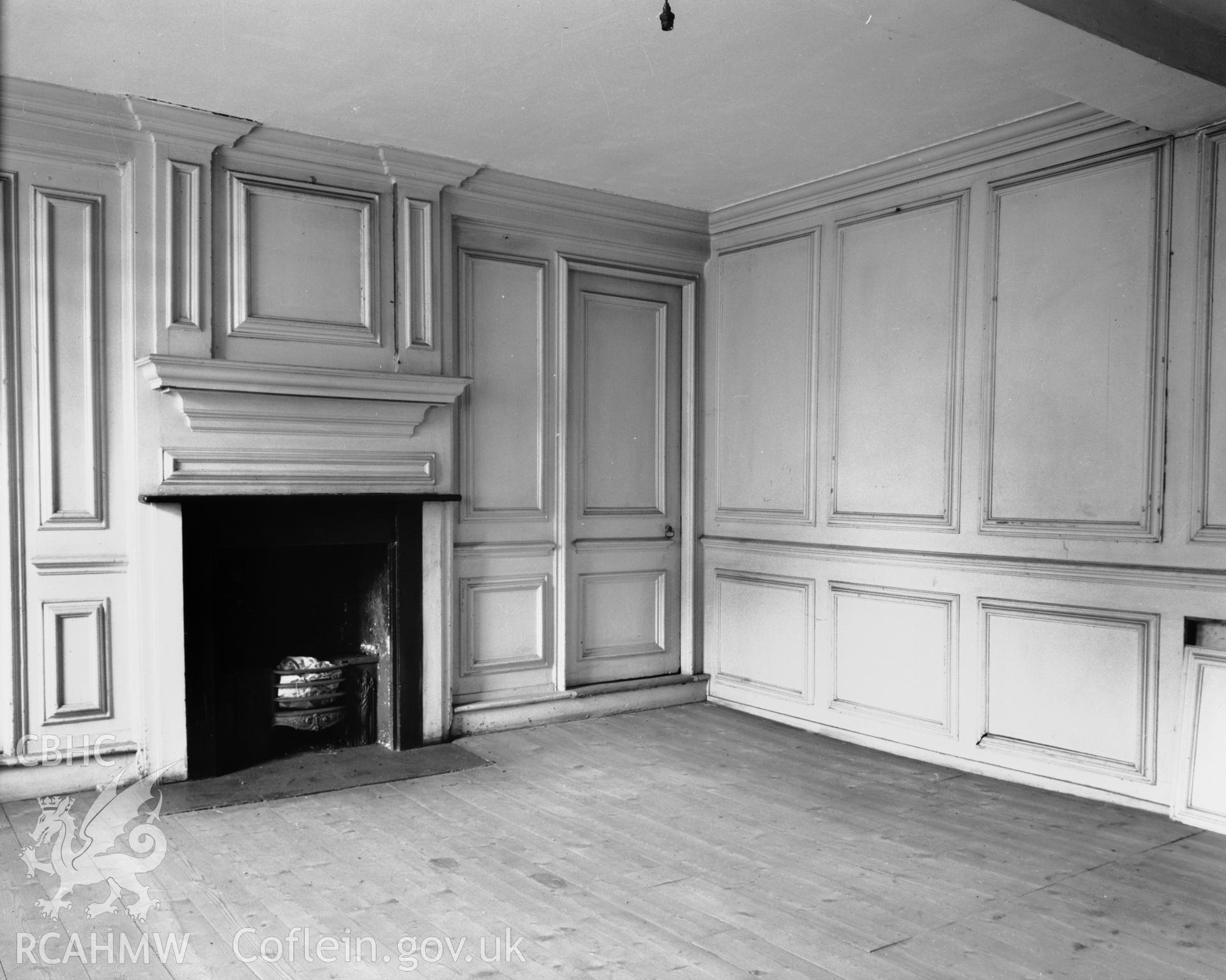 View of interior showing panelling and fireplace