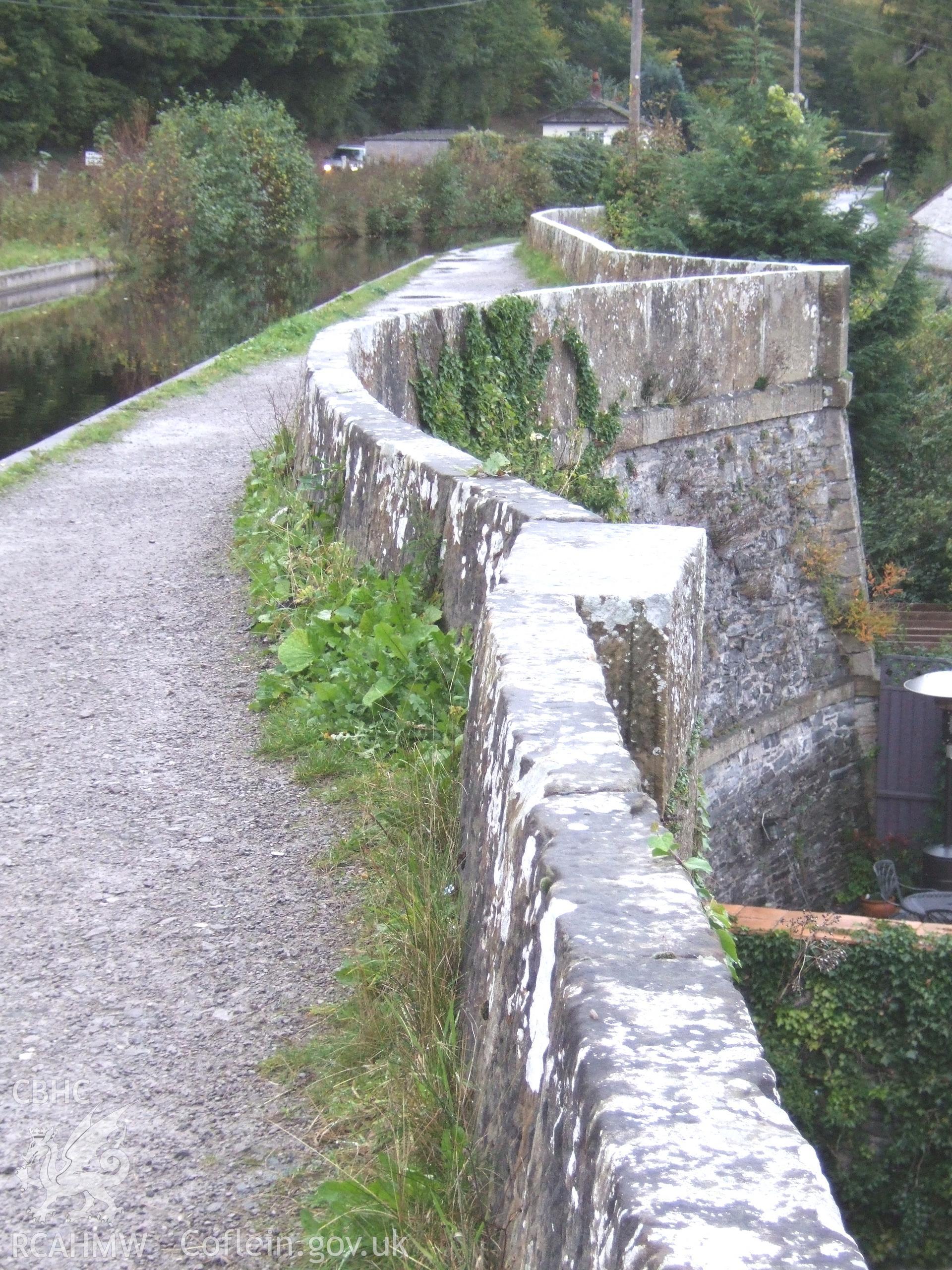 South face of the aqueduct river-arch ahowing the two block string-courses and ashlar (squared stone) quoining at the wing-wall end.