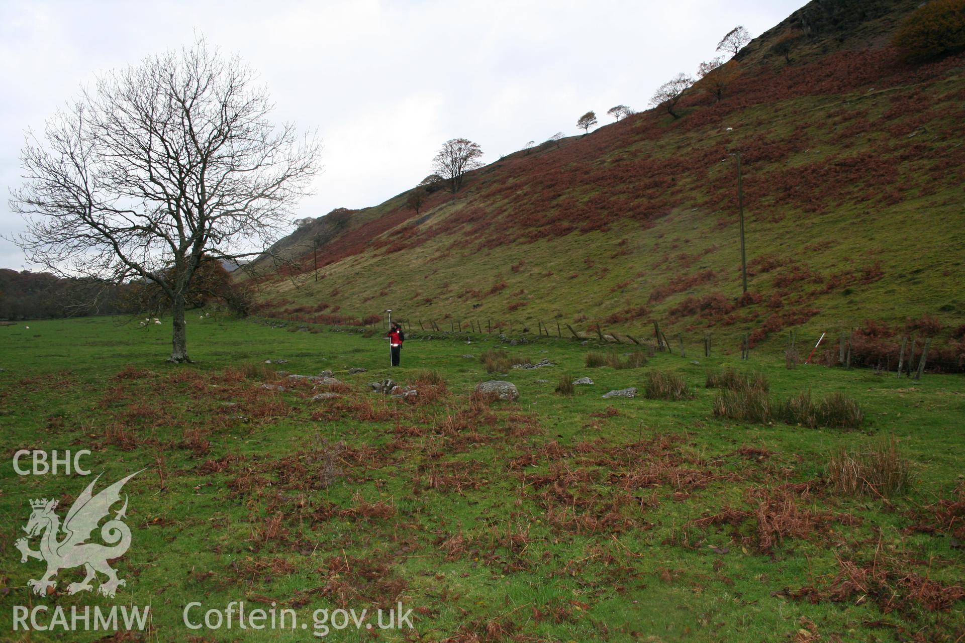 Surveying the earthwork remains of the Cwm Du settlement from the south-east