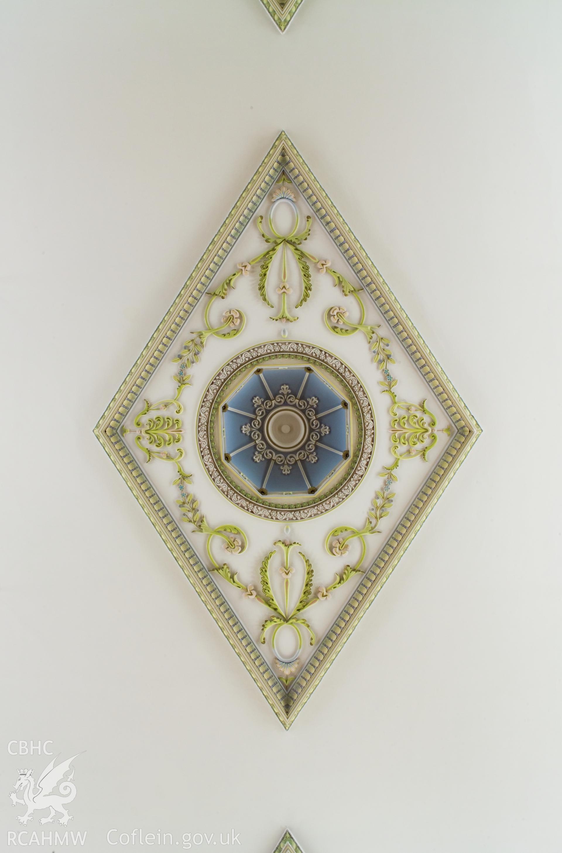 Central; ceiling decoration.