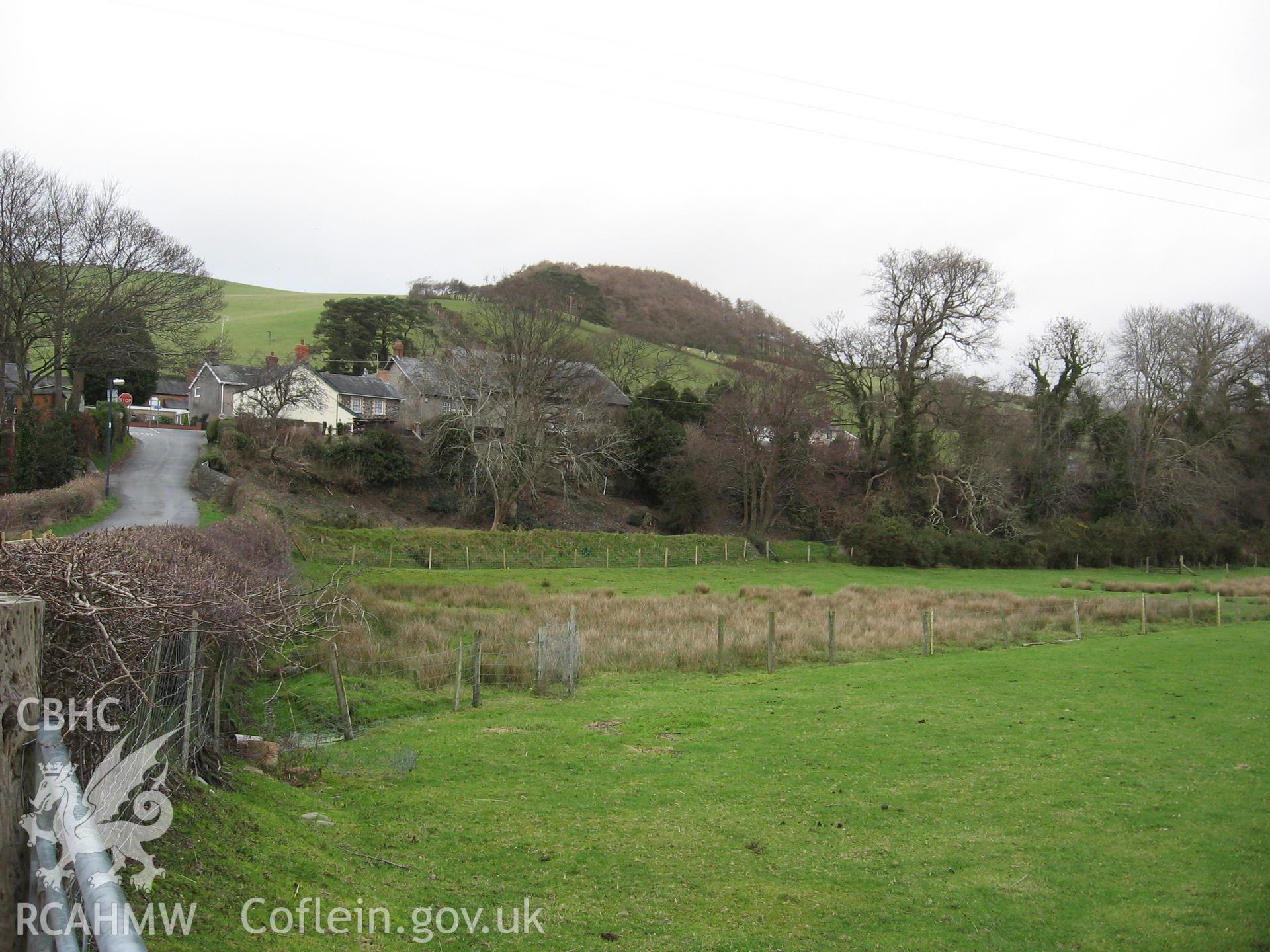 Capel Penllwyn, site of cist burial. General view of chapel site from south-west, showing elevated river terrace and hillslope beyond.