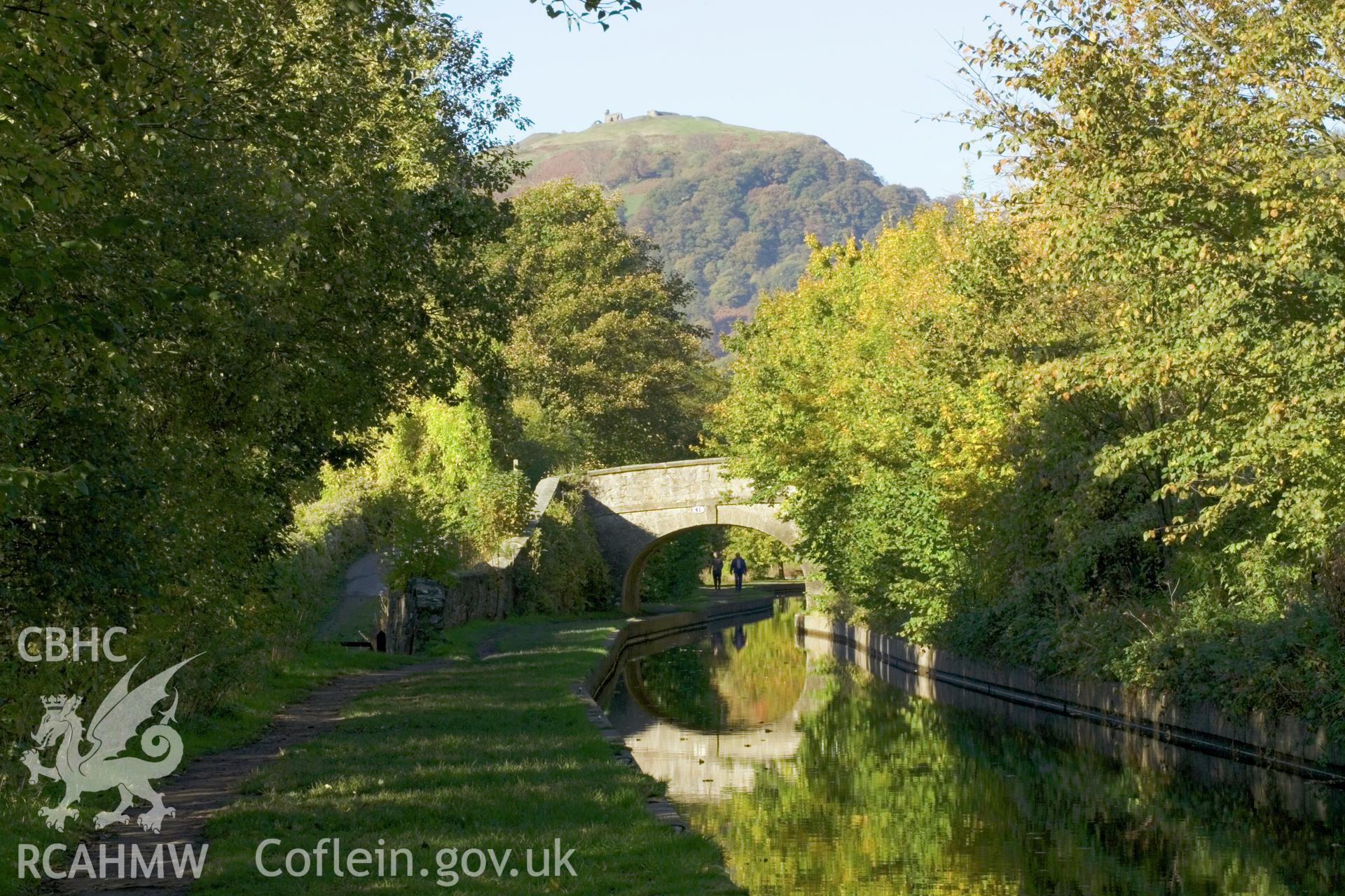 Bridge and Castell Dinas Bran (from east) with figures.