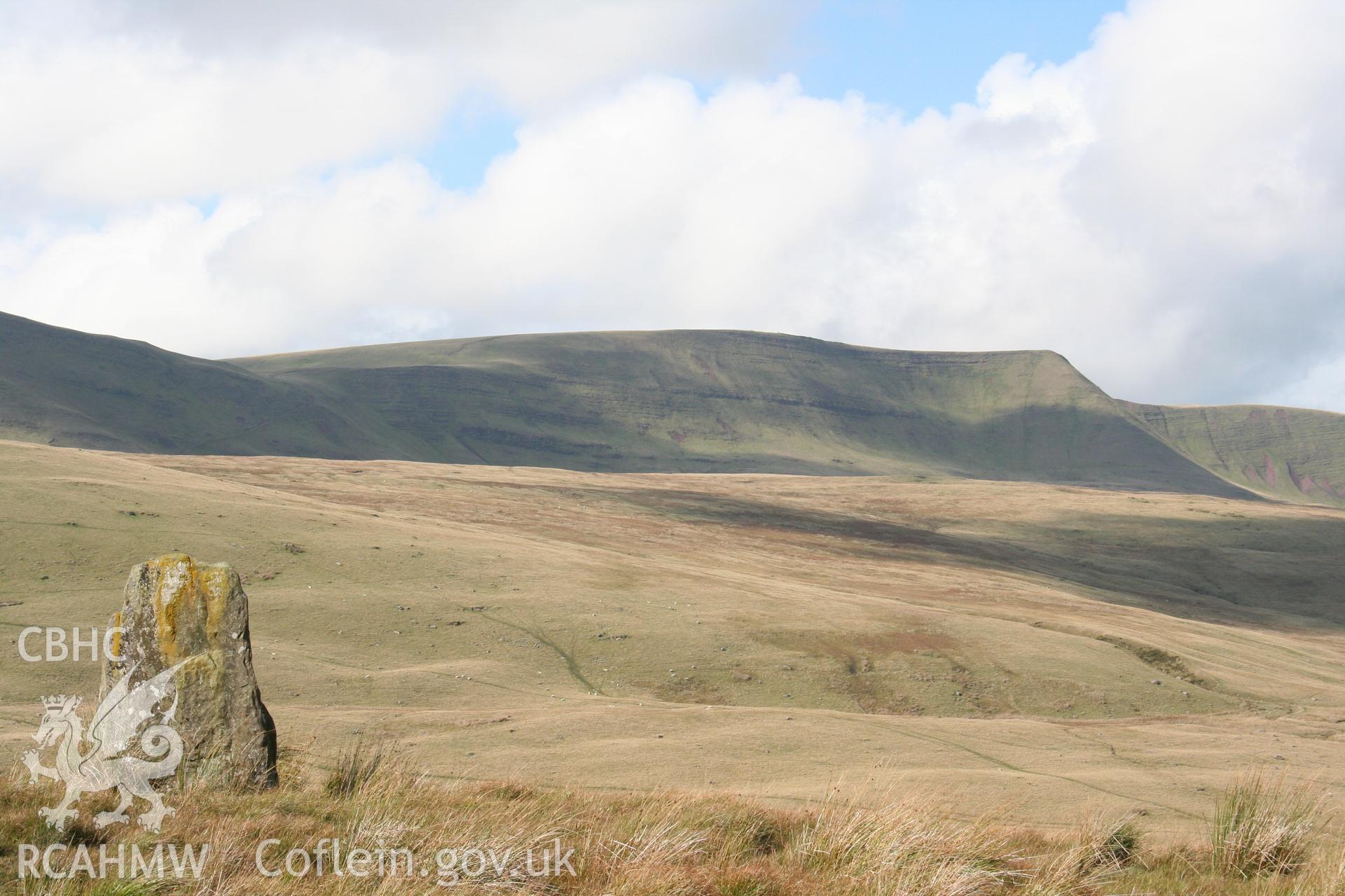 Waun Leuci Standing Stone. Monolith viewed from the north-east, with Fan Hir in the background.
