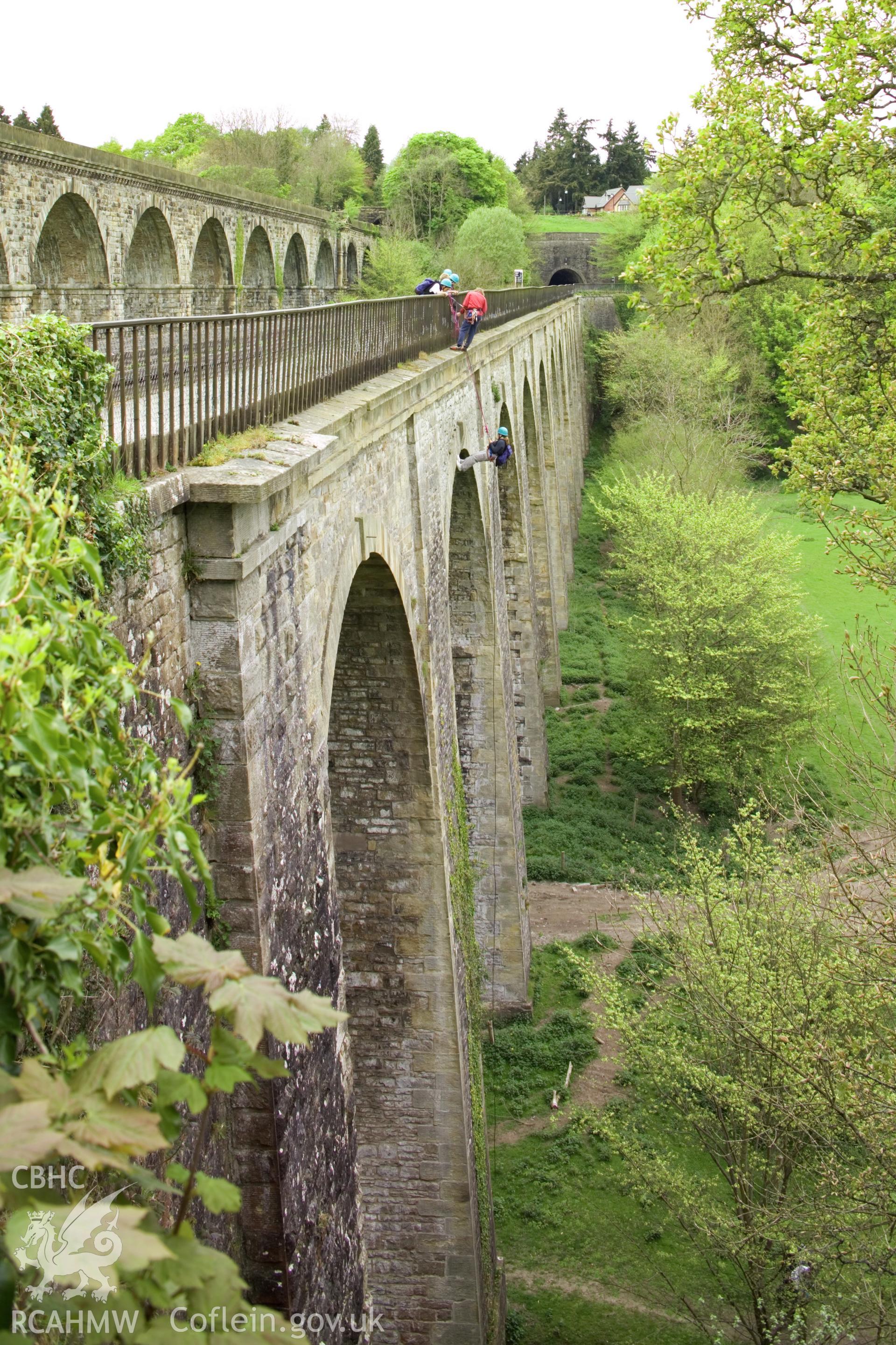 Oblique viewpoint from south southeast, with child abseiling. Vertical