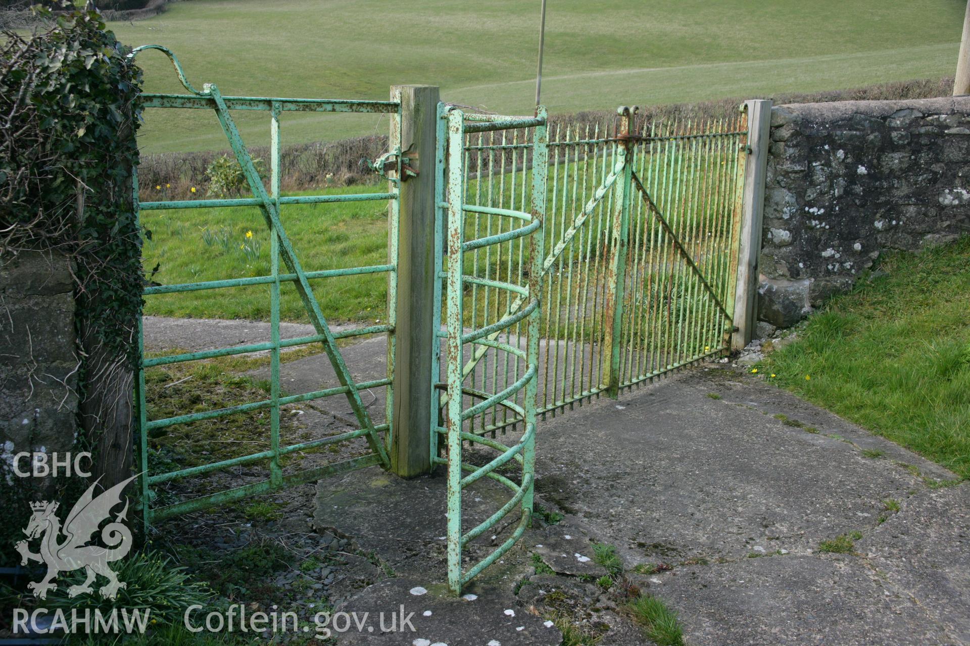 Cast iron gate into graveyard.