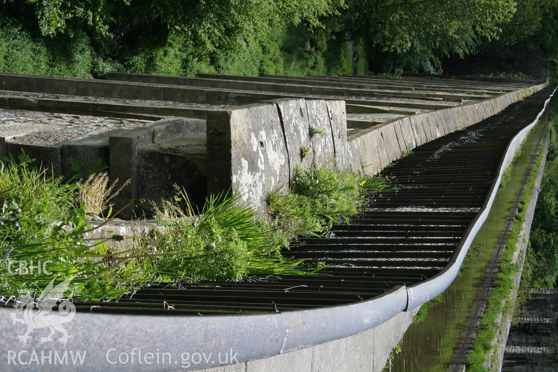 The south elevation of the Chirk Aqueduct viewed from the south end, showing the projecting plinth and stringcourses, and the undulating effect formed by the projectin columns on the front of the piers