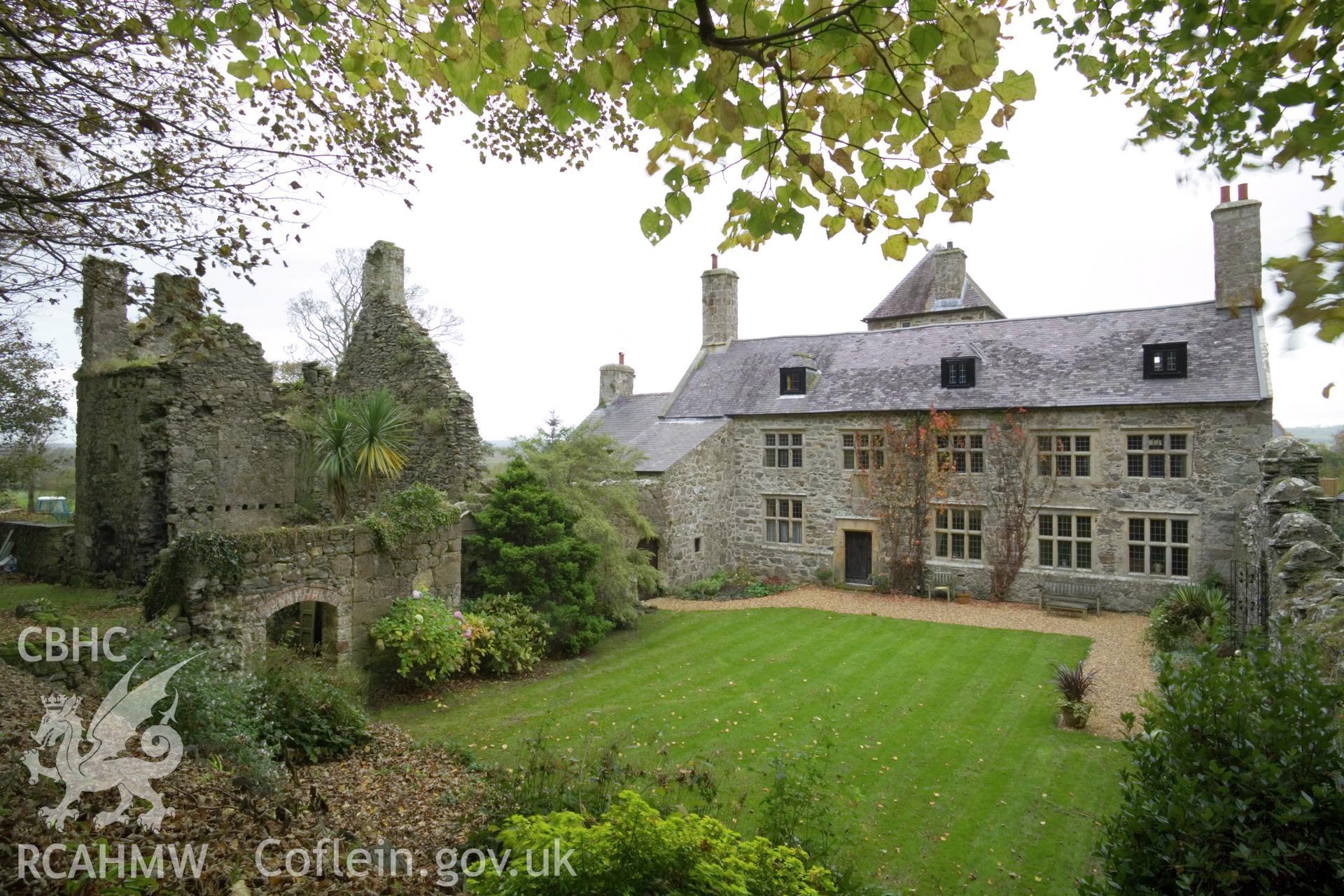 Exterior from the east, including ruined earlier house.