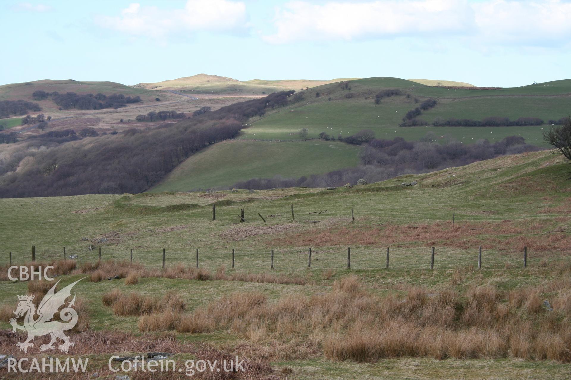 Looking across to the earthwork remains of the farmstead from the east