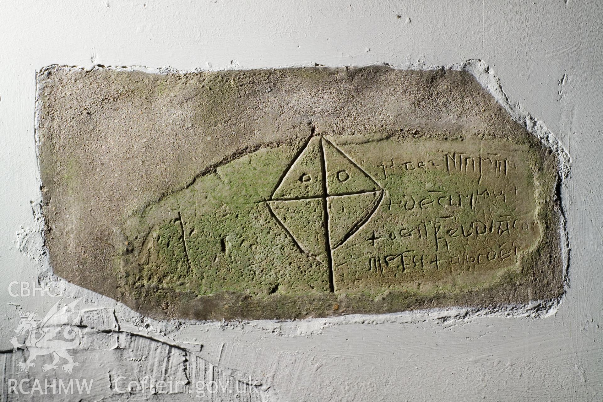 Inscribed stone set in interior north wall