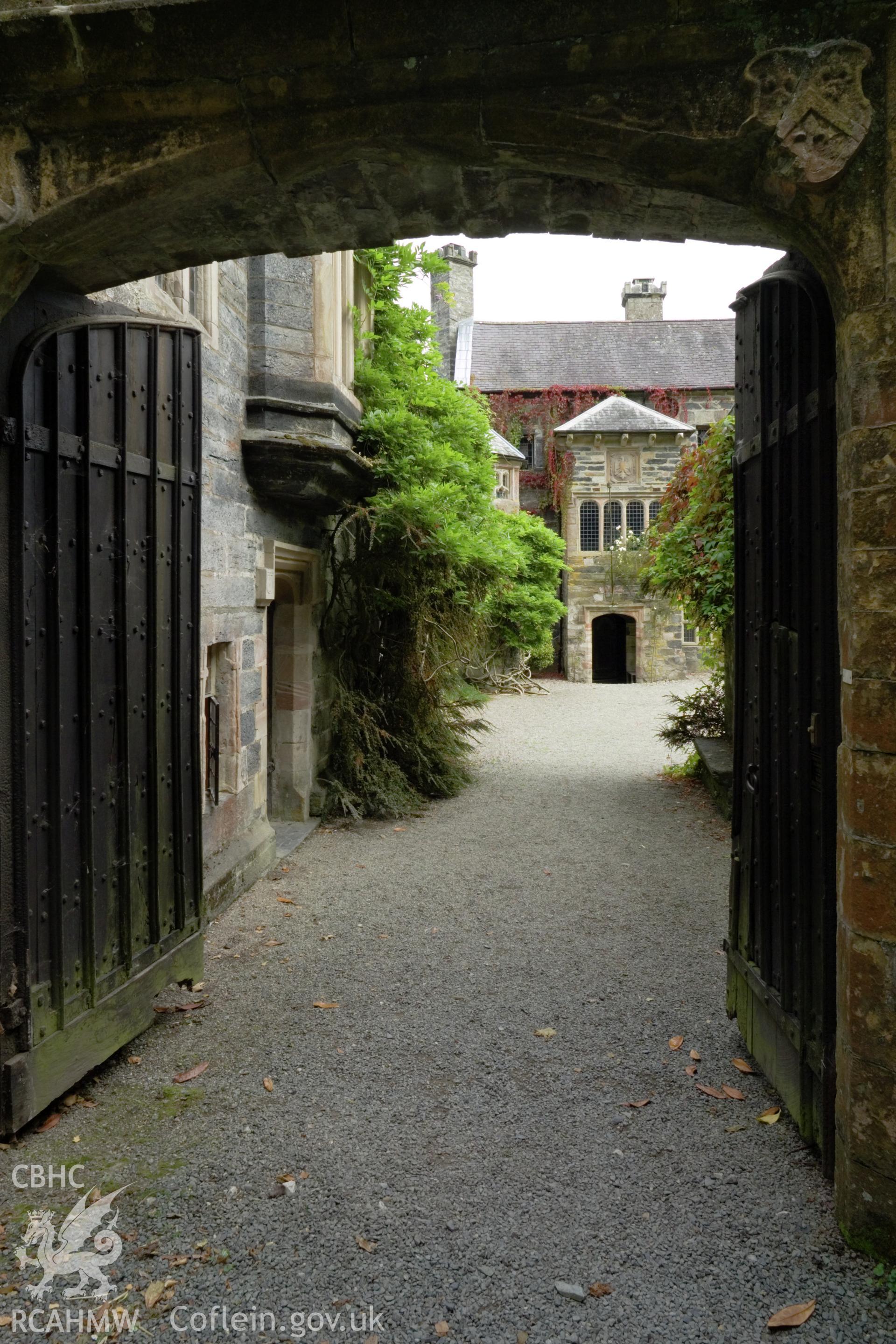 House viewed through entrance gate from the southwest.