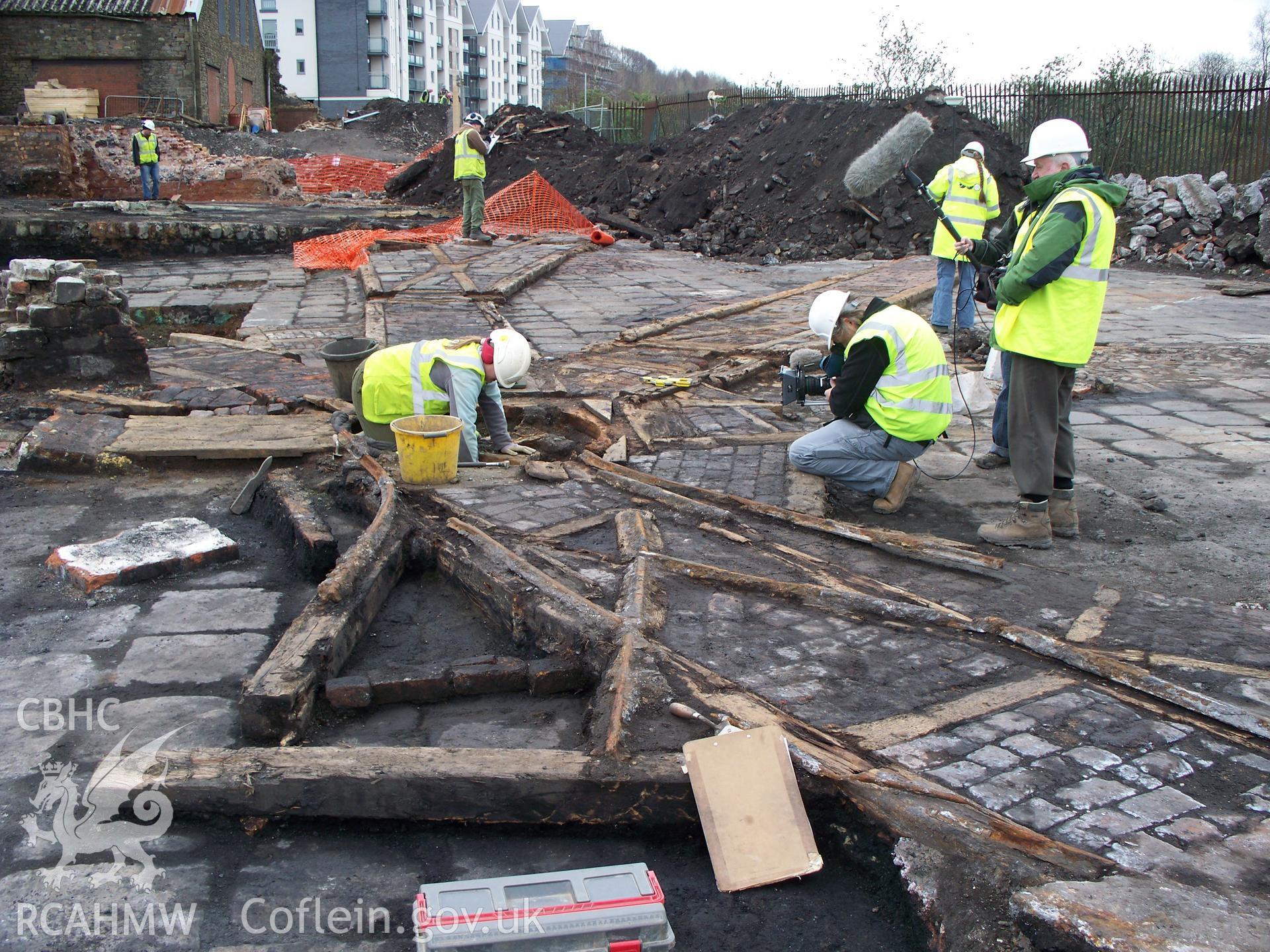 TV filming at railways on copperworks wharves, remaining building in background & flats over former rolling-mills on south of site.