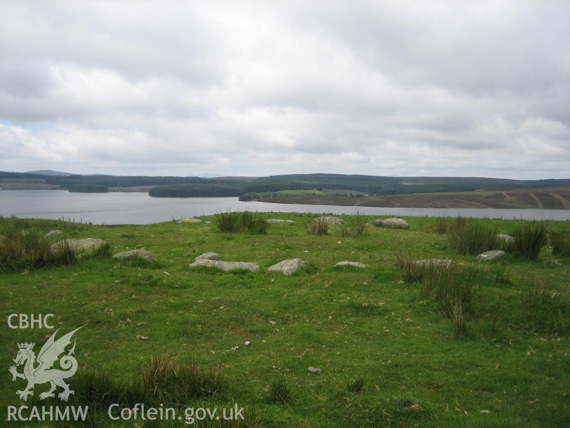 Waen Ddafad carin from the east, with Llyn Brenig in the background.