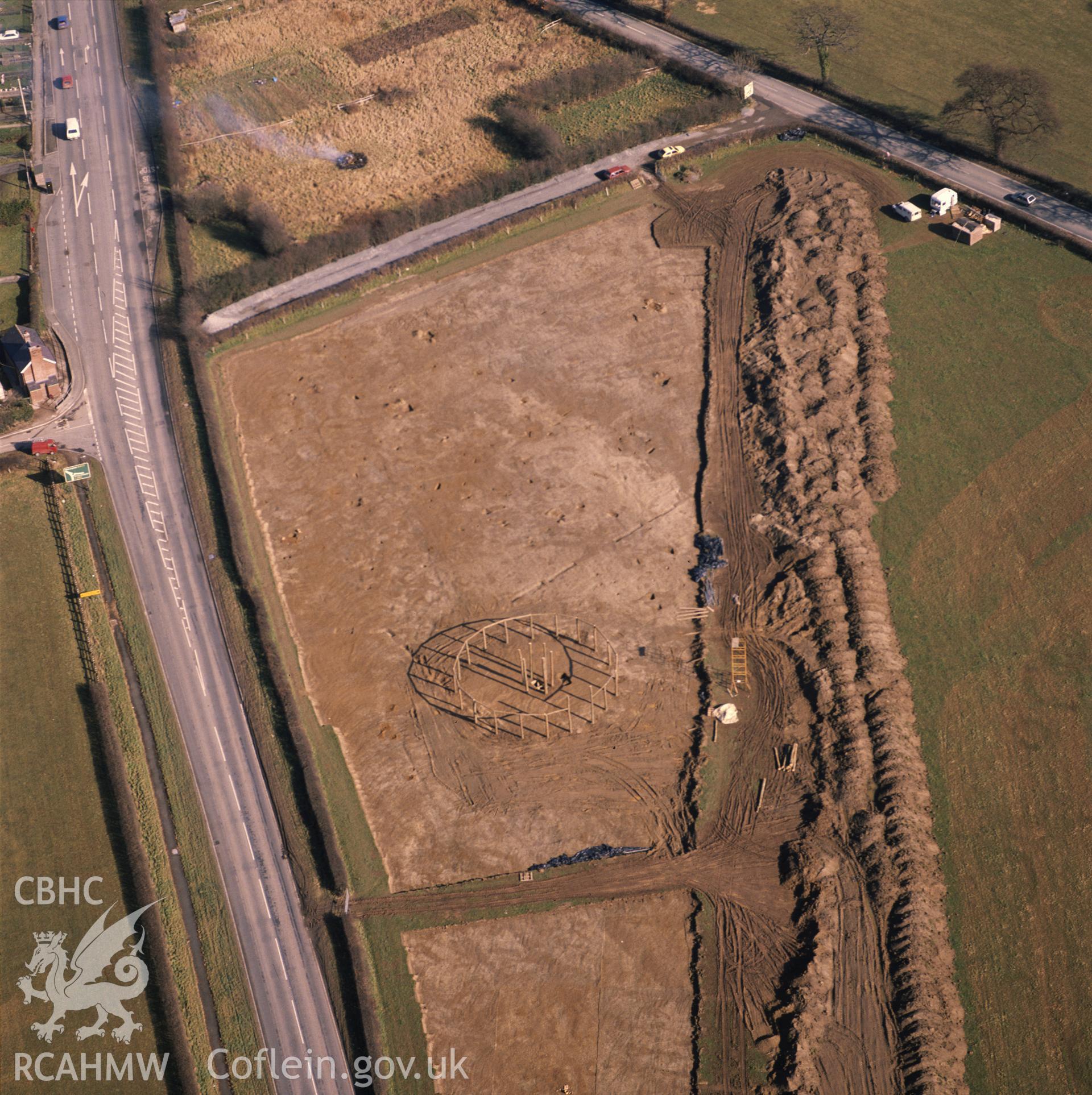 RCAHMW colour oblique aerial photograph of Sarn Bryn Caled Pit Circle. Taken by C R Musson 1991