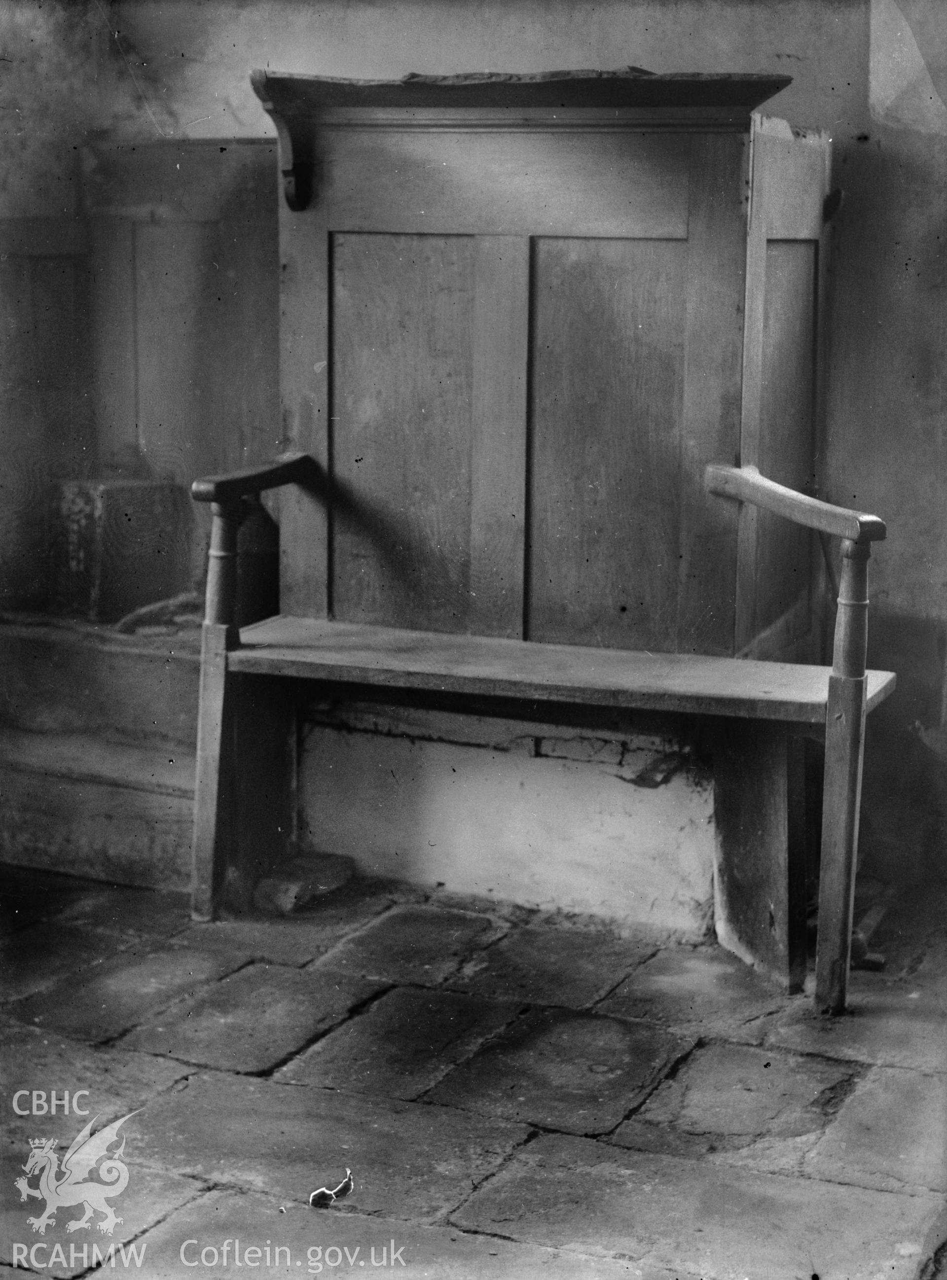 Black and white photo showing chair at Llansadwrn Church.