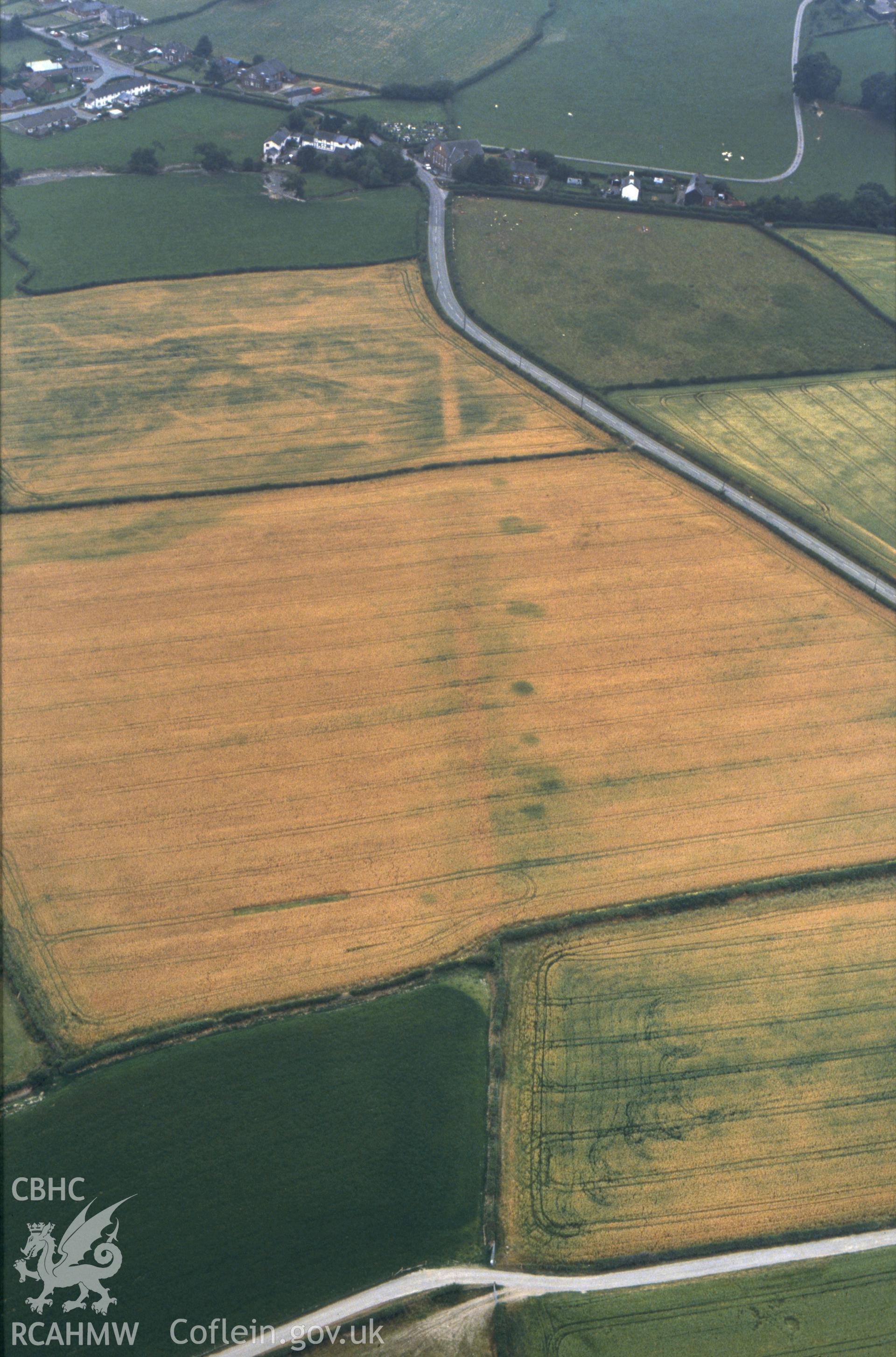 RCAHMW colour slide oblique aerial photograph of section of Roman road between Penrhos and Trefeglwys, Trefeglwys, taken by C.R. Musson, 24/07/94