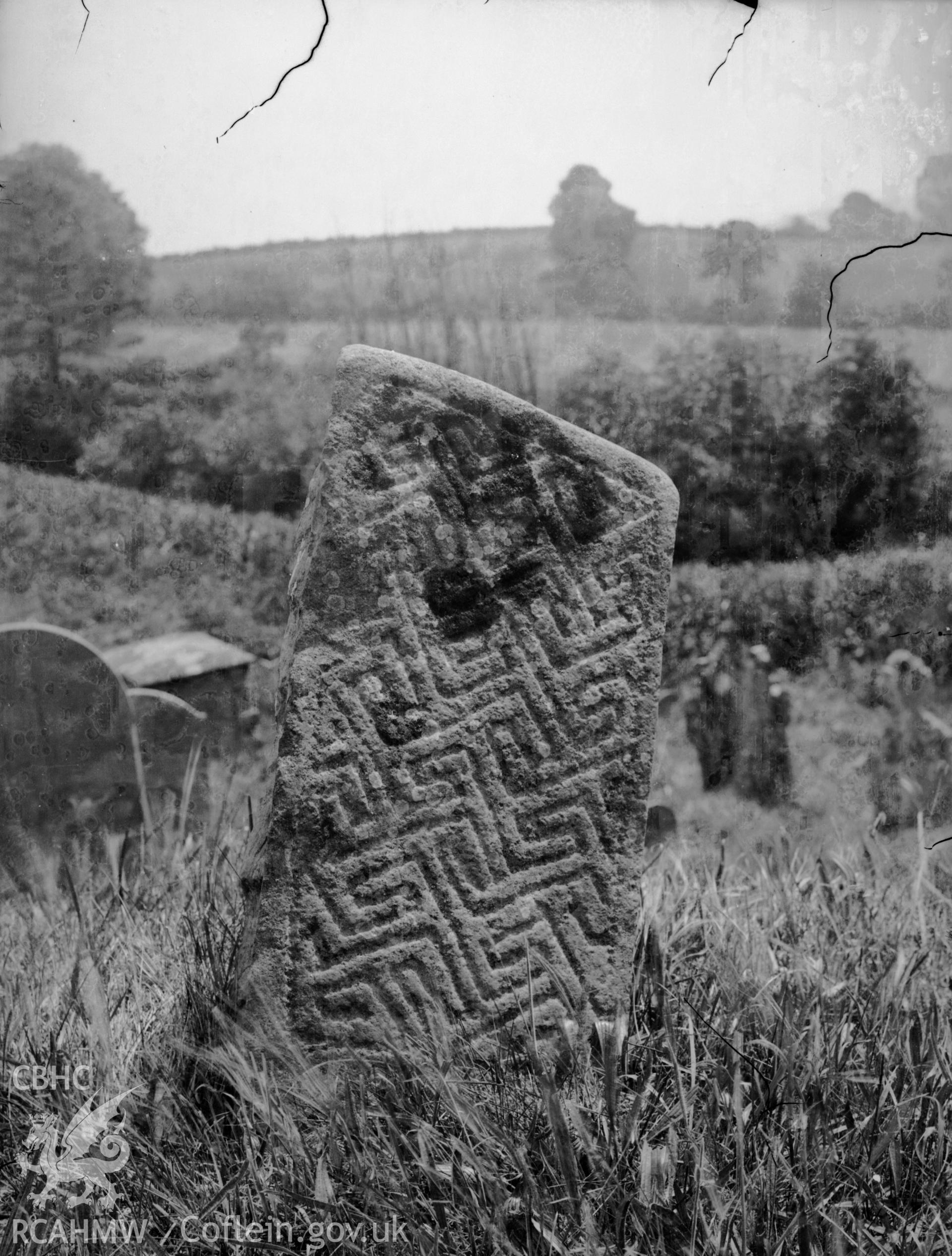 Black and white photo showing incised stone in Silian Churchyard.