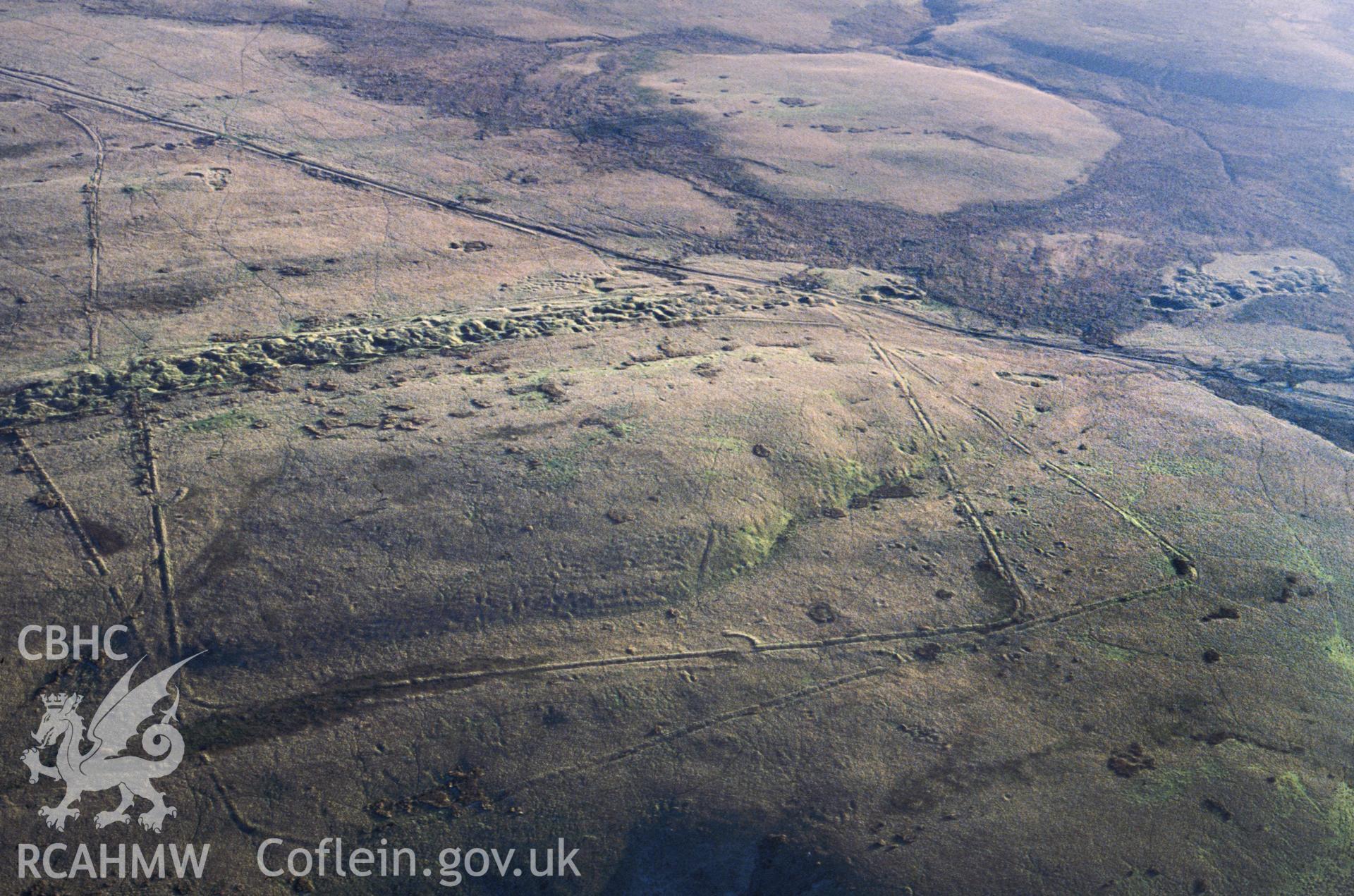 RCAHMW colour slide oblique aerial photograph of Y Pigwn Marching Camps, Myddfai, taken by CR Musson on 24/11/88