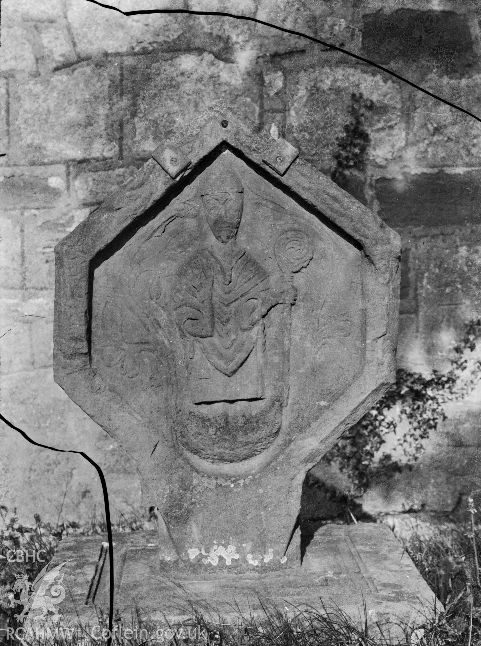 Black and white photo showing a memorial stone at Llanrhydd Church.