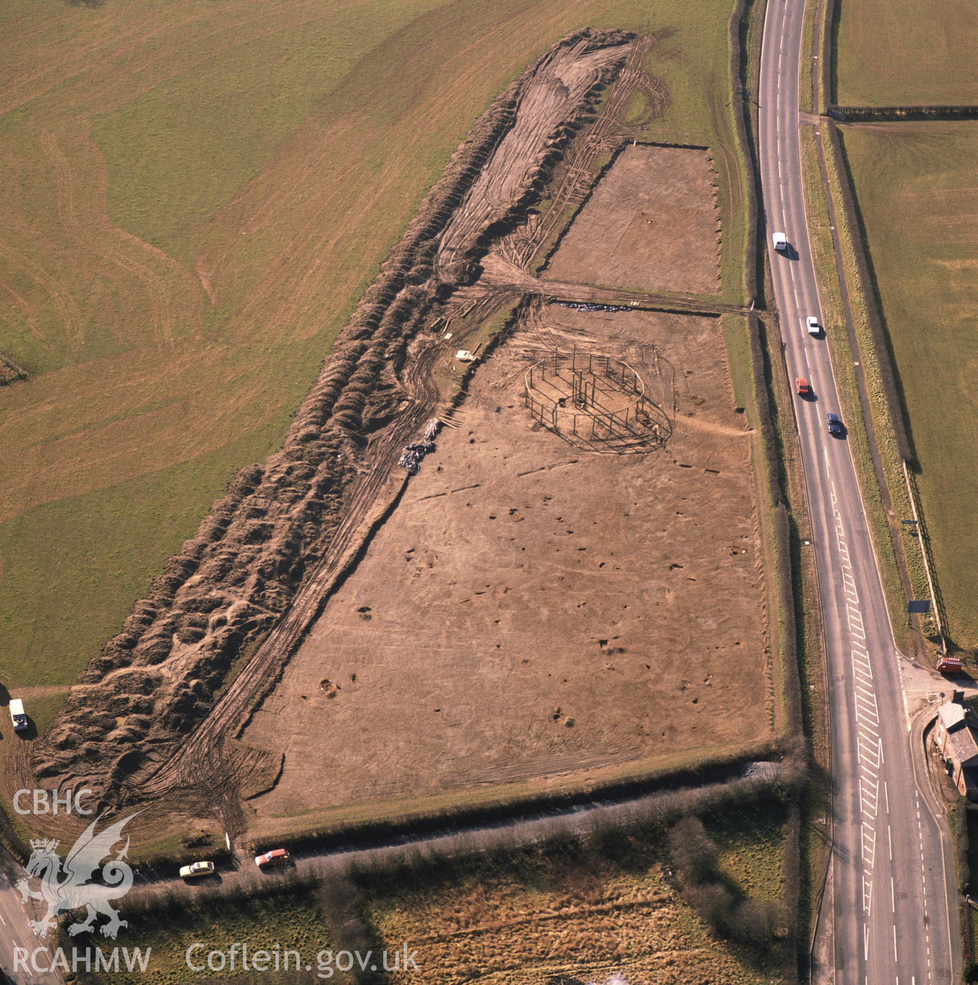 RCAHMW colour oblique aerial photograph of Sarn Bryn Caled Pit Circle. Taken by C R Musson 1991