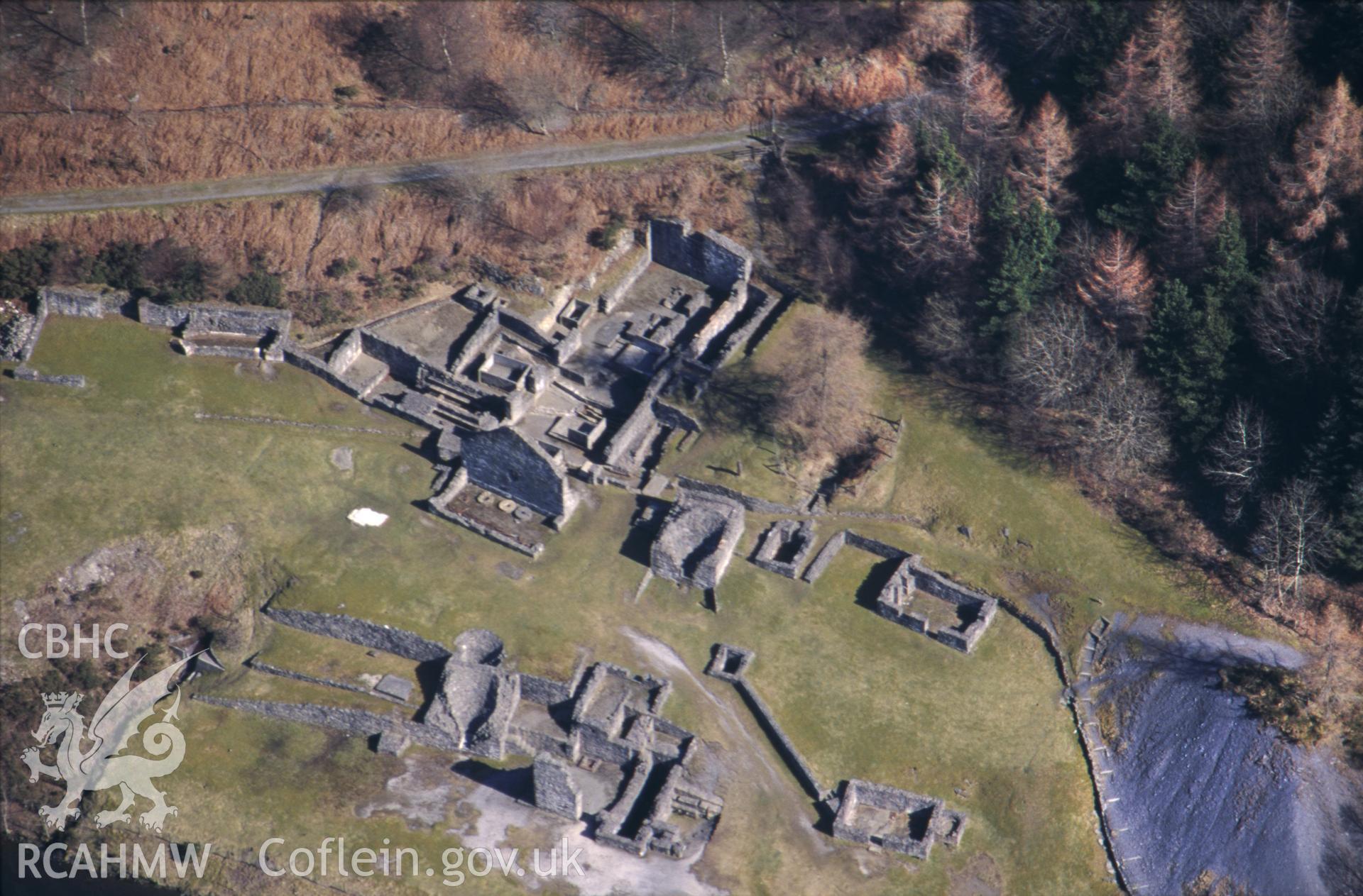 RCAHMW colour oblique aerial photograph of Bryntail lead mine taken on 21/03/1995 by C.R. Musson