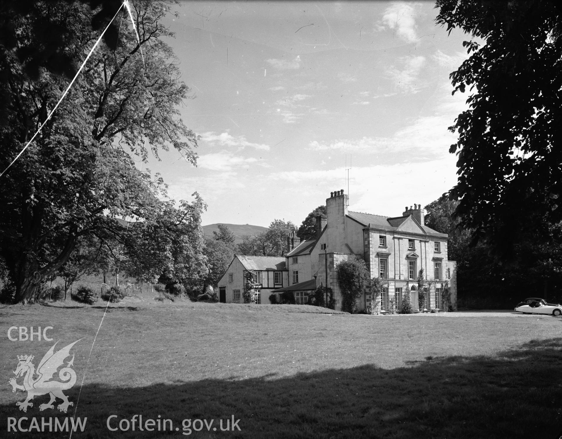 The house from the SW, with Moel Famau in the distance